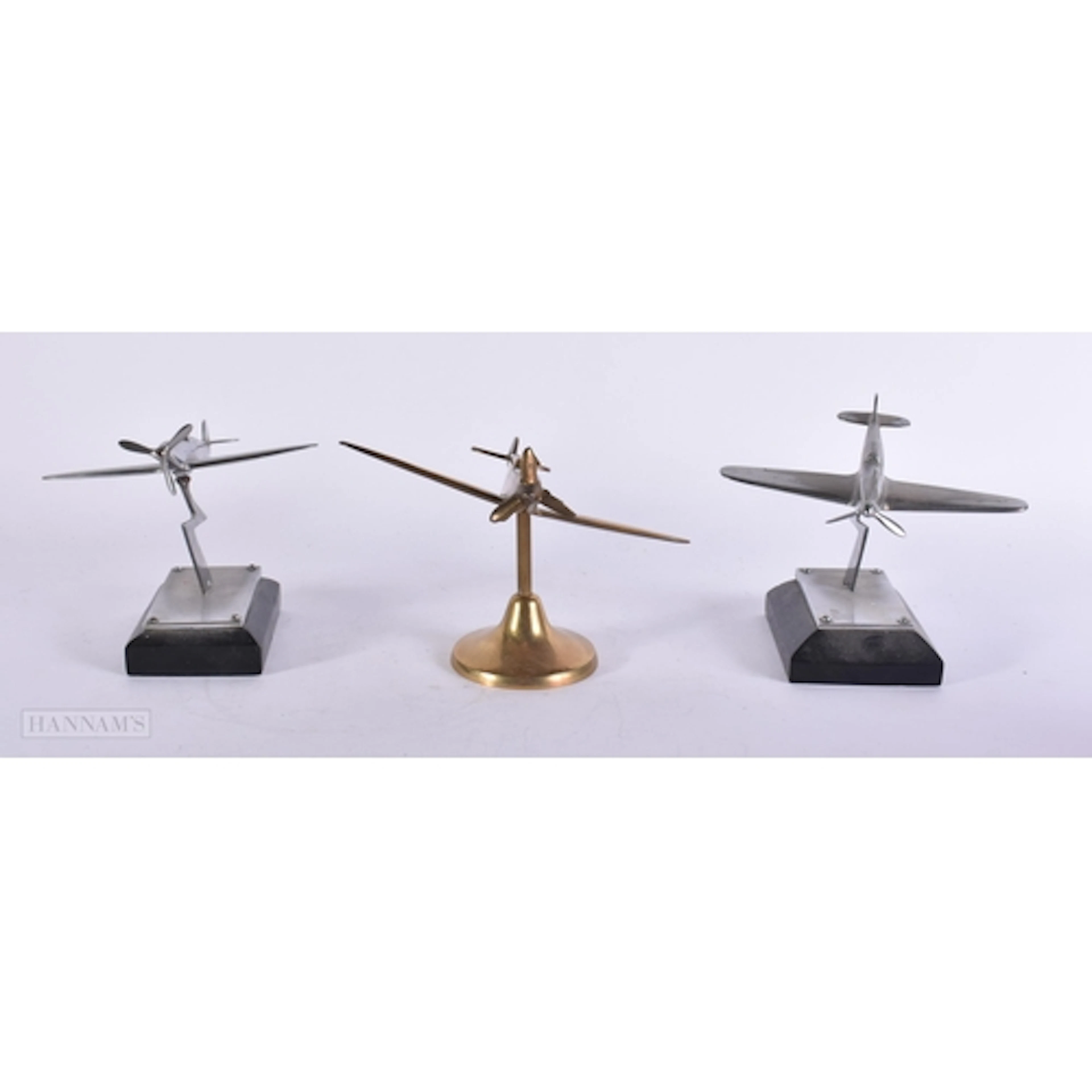 THREE MILITARY INTEREST AERONAUTICAL CAR MASCOTS. (3)