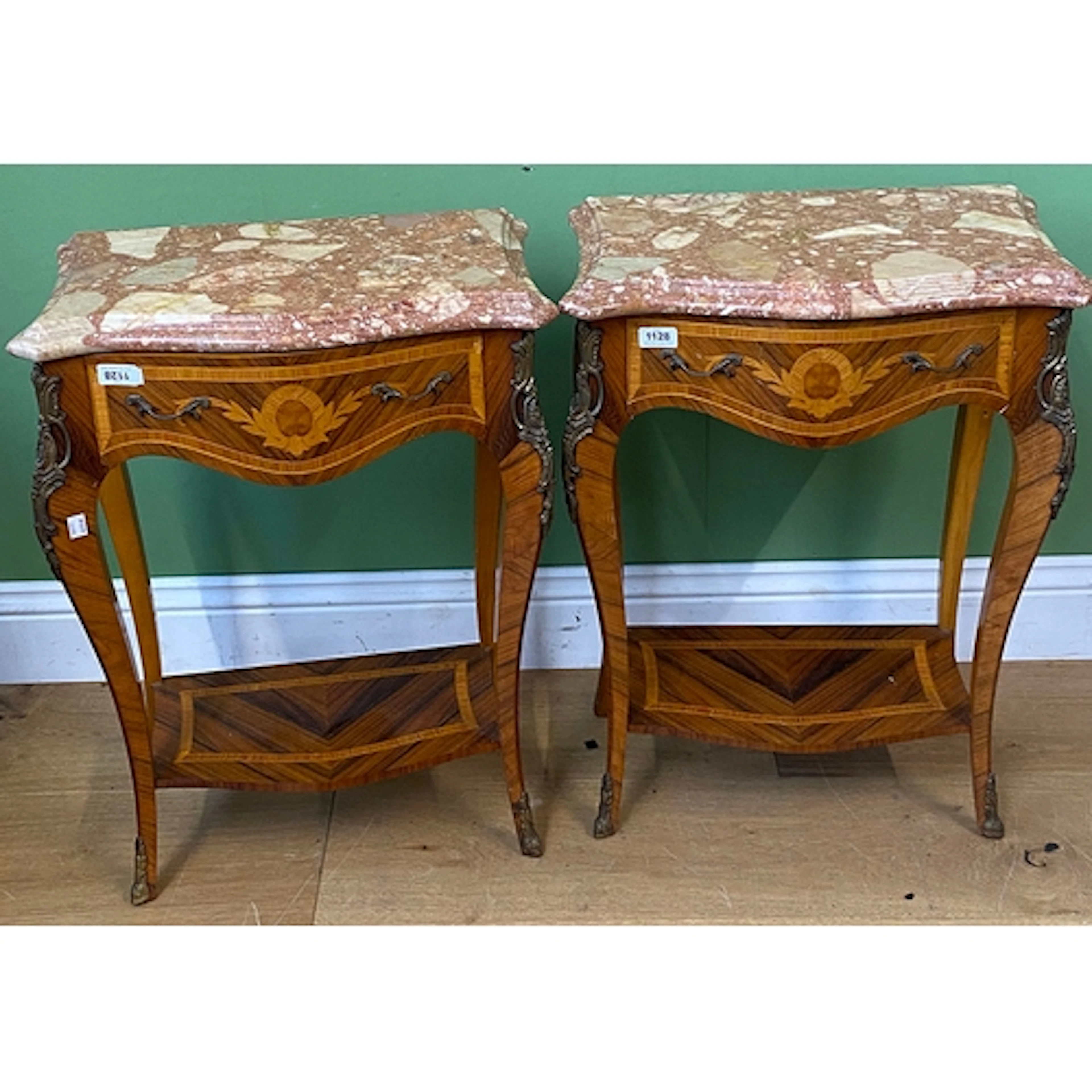 A pair of Continental style serpentine marquetry side tables...