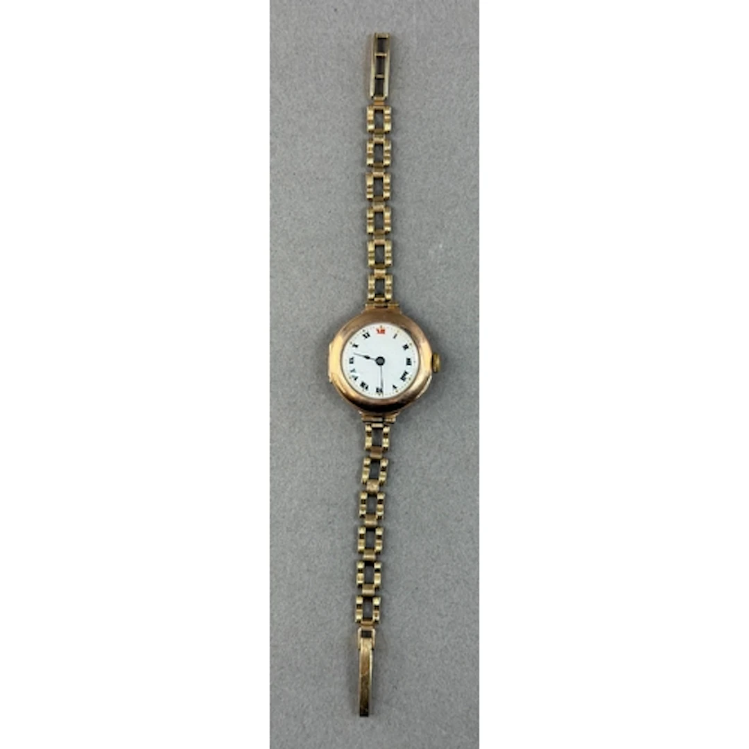 Watches: a 9ct yellow gold trench style wristwatch on open l...