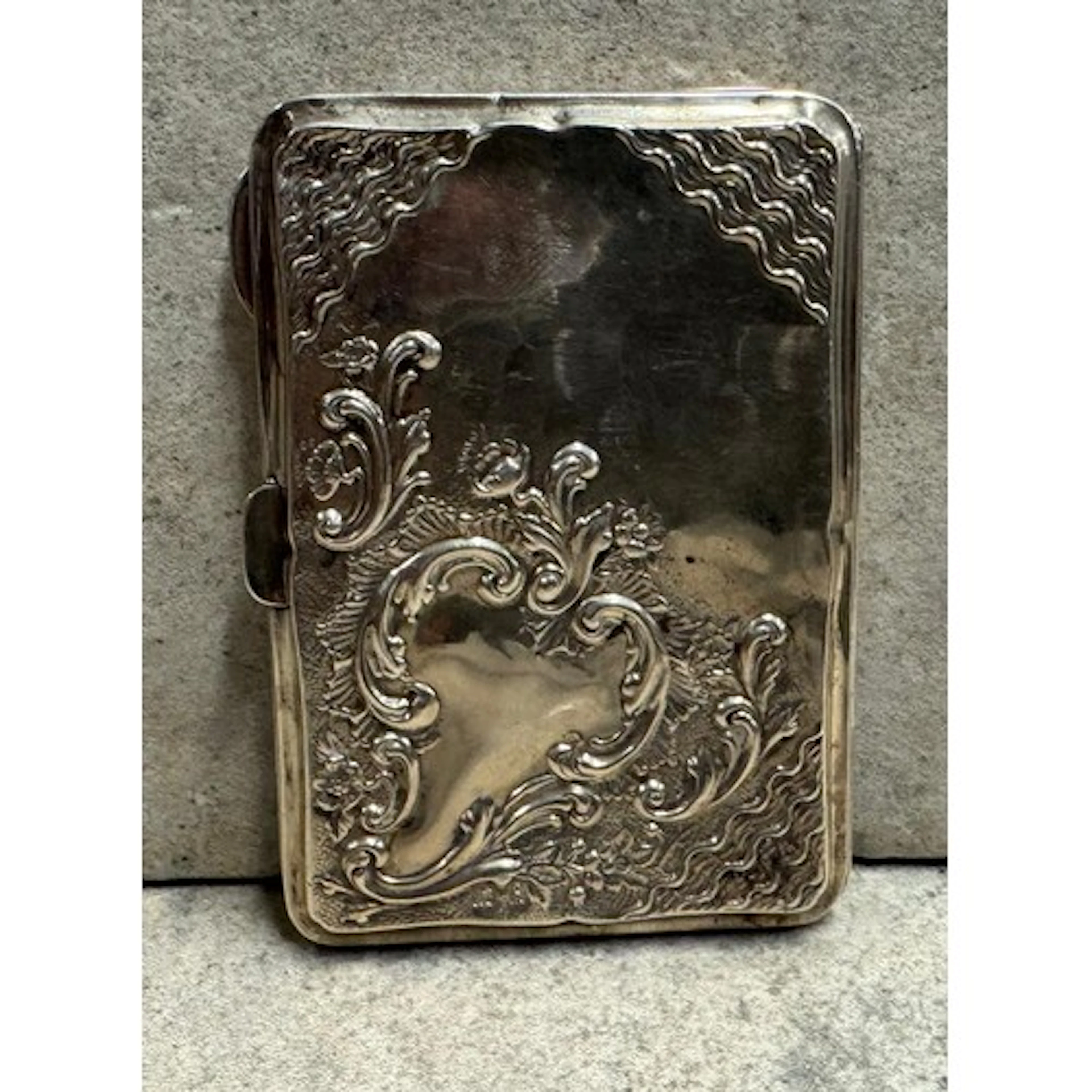 A chased silver card case. Birmingham 1906. Approx. 55 grams...