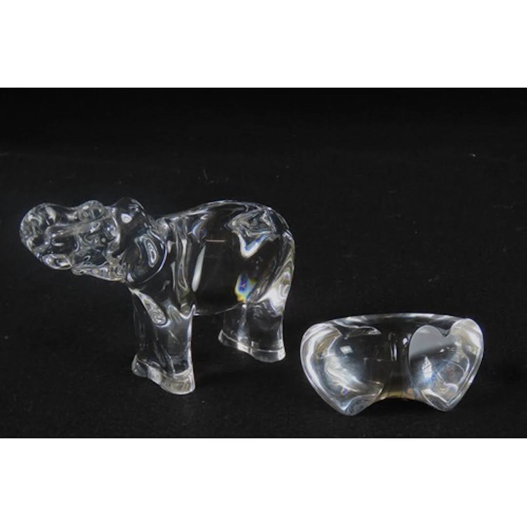 A BACCARAT GLASS MODEL OF AN ELEPHANT modelled standing four...