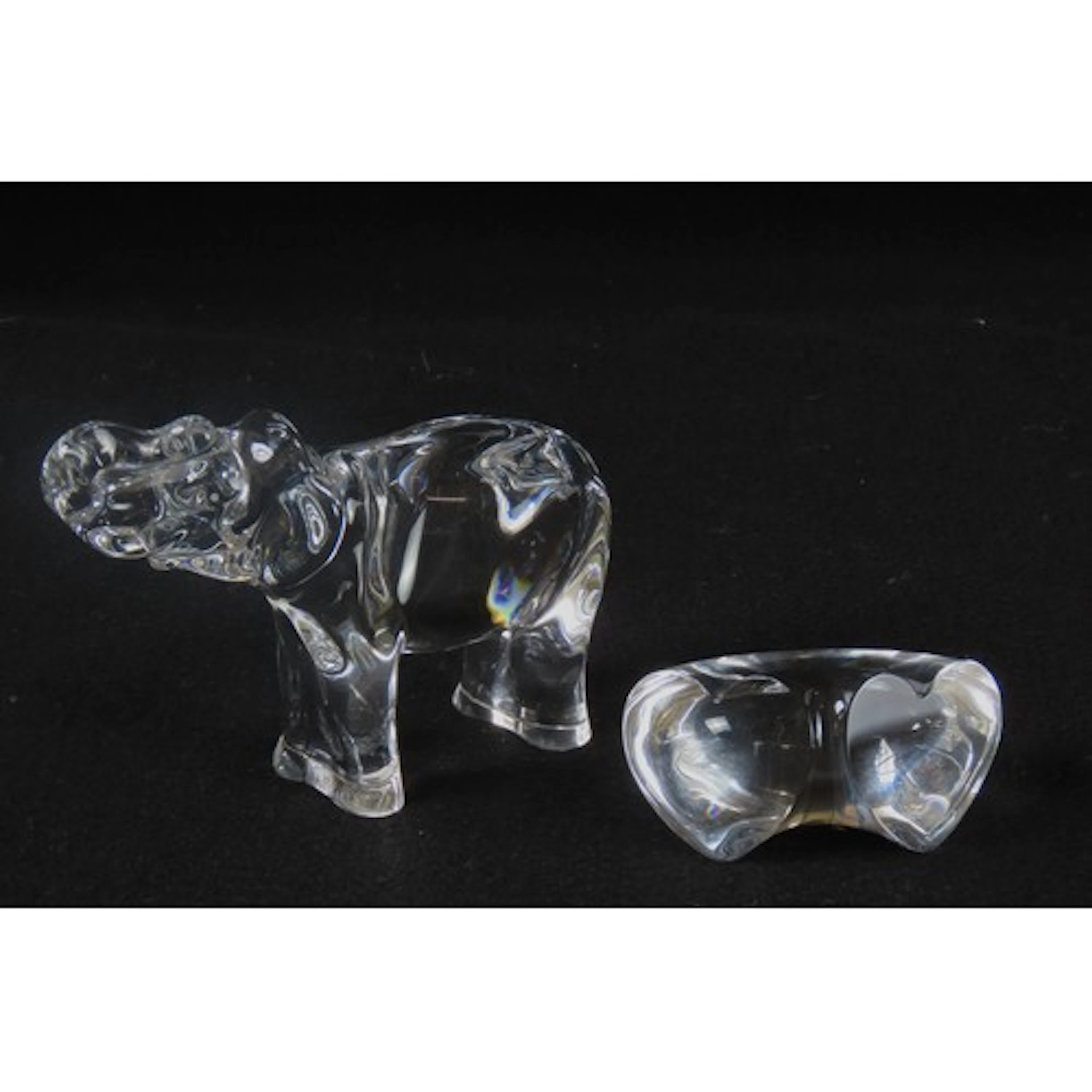 A BACCARAT GLASS MODEL OF AN ELEPHANT modelled standing four...