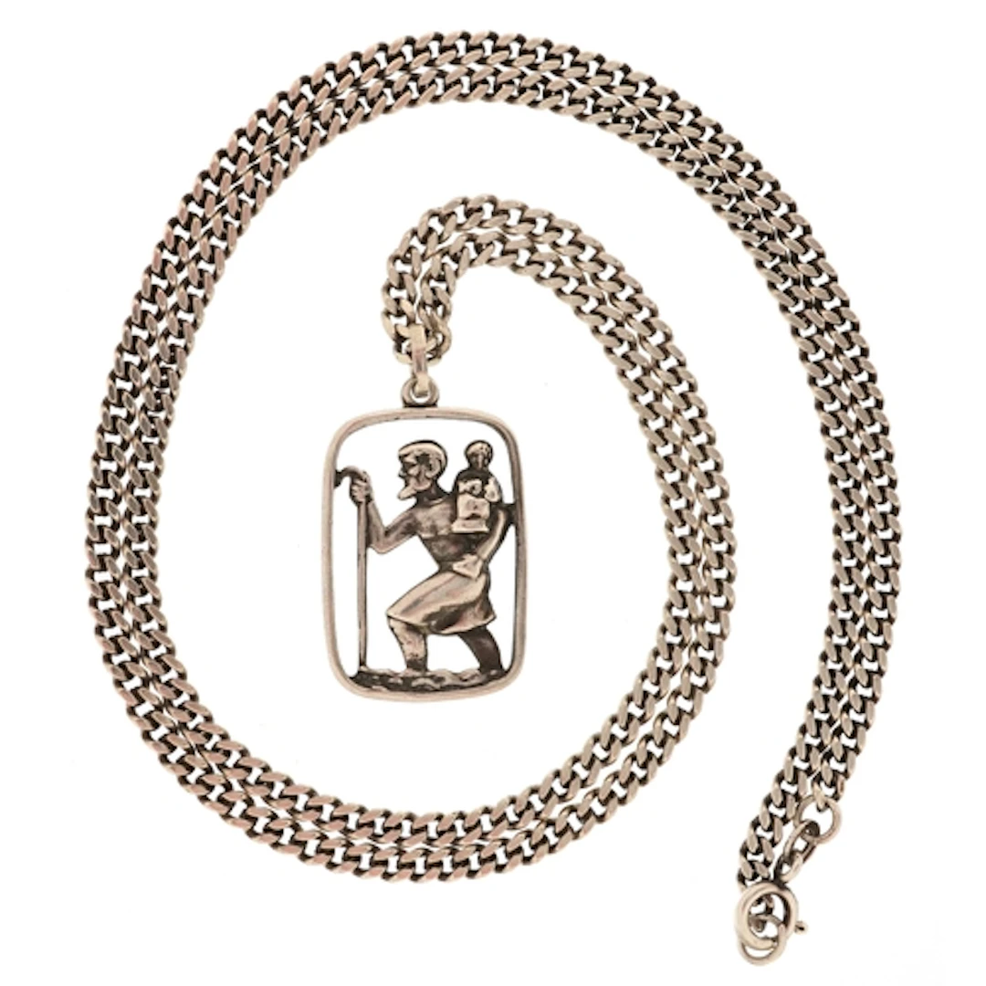 Silver St. Christopher pendant on a silver curb link necklac...