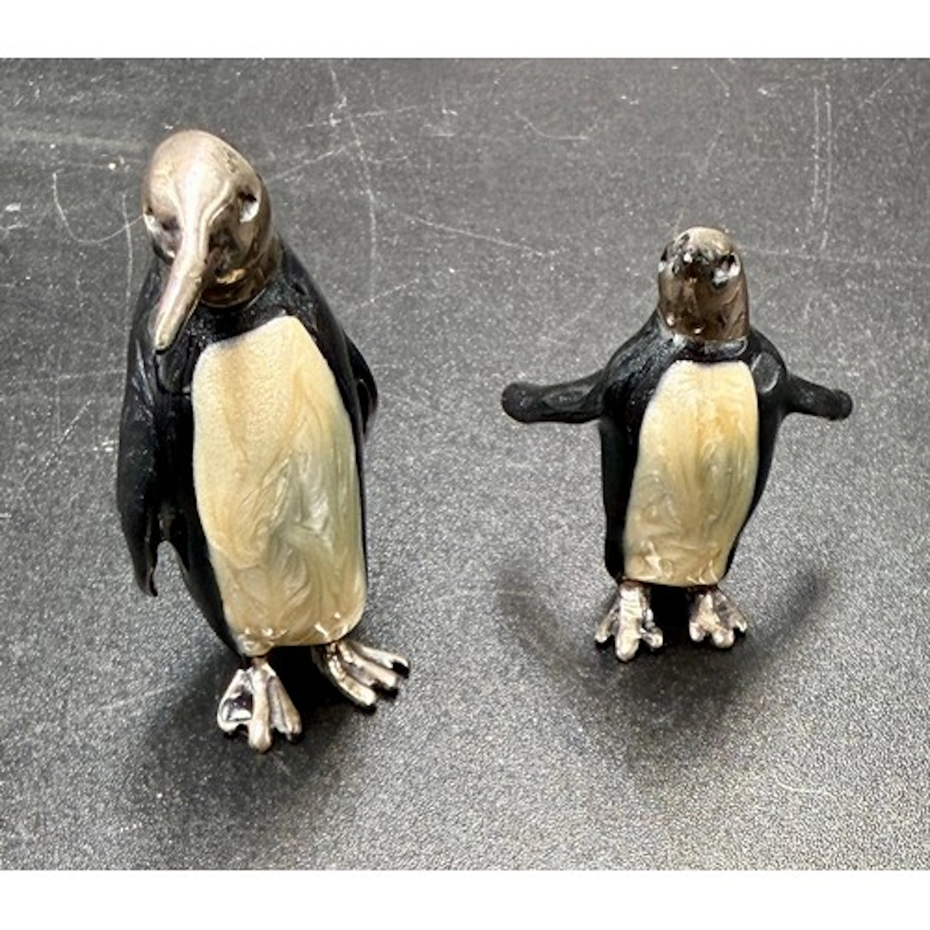 Two sterling silver and enamel penguins. Tallest 4.l5cm h. T...