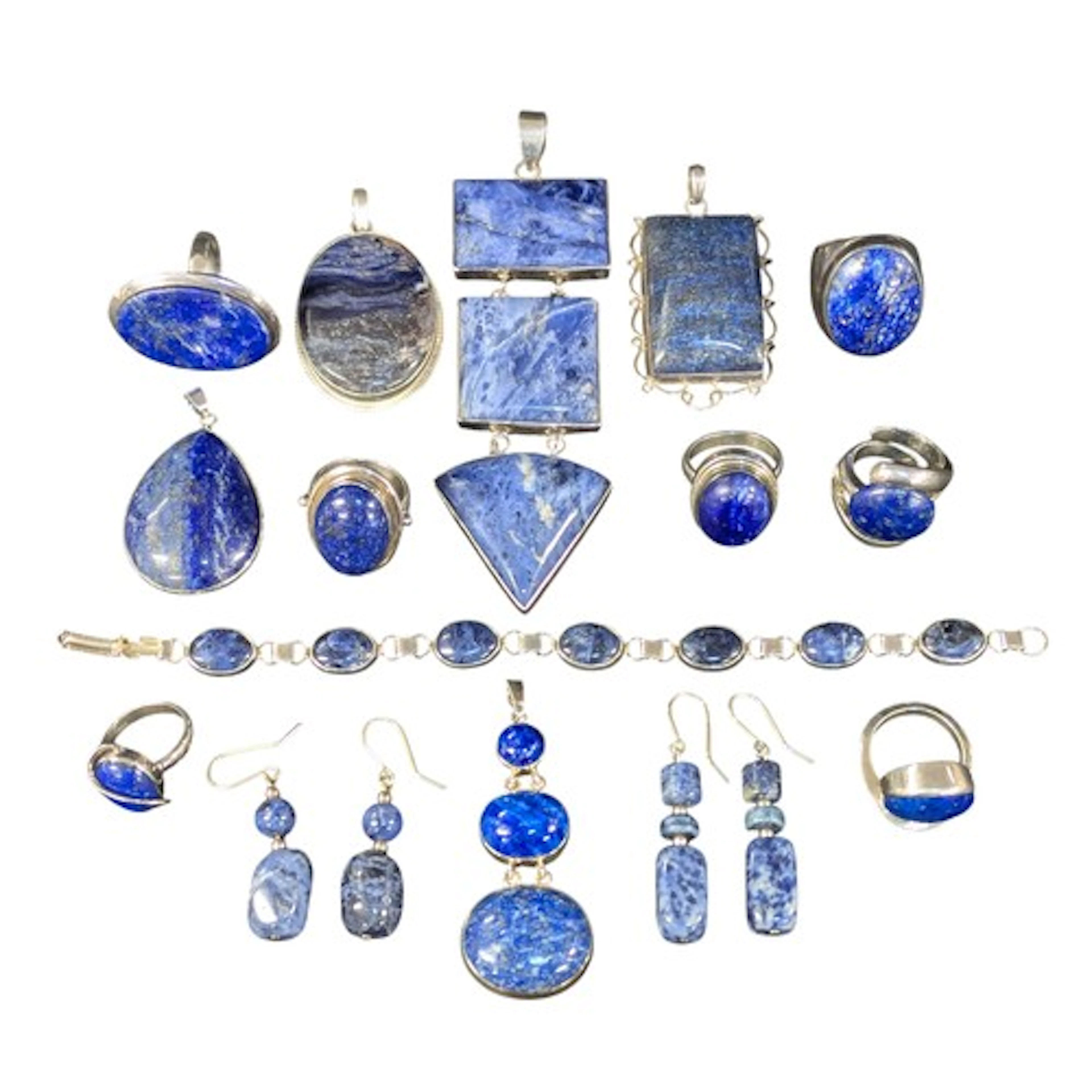 A silver mounted sodalite three panel pendant, others oval, ...