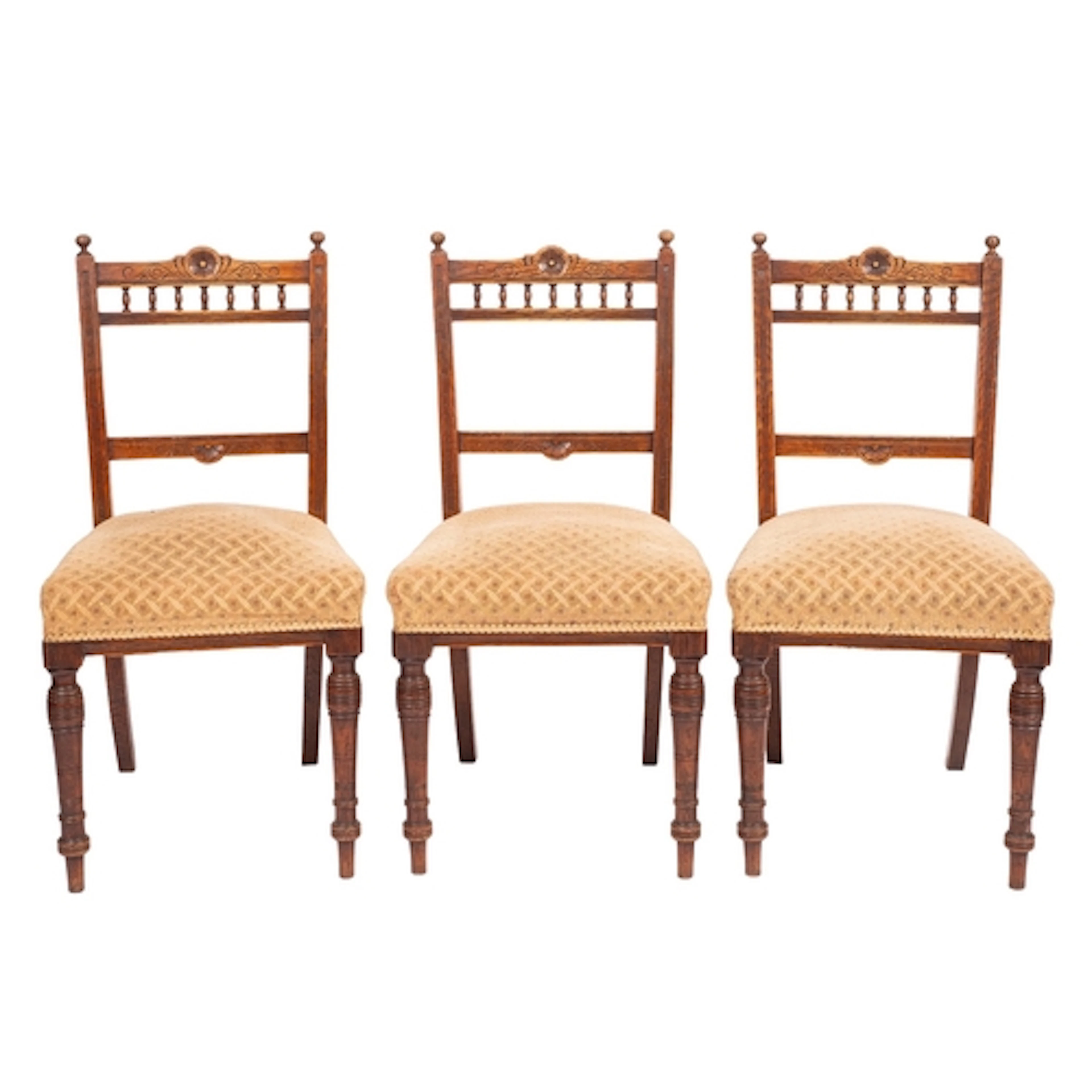 A set of three late Victorian oak and upholstered side chair...