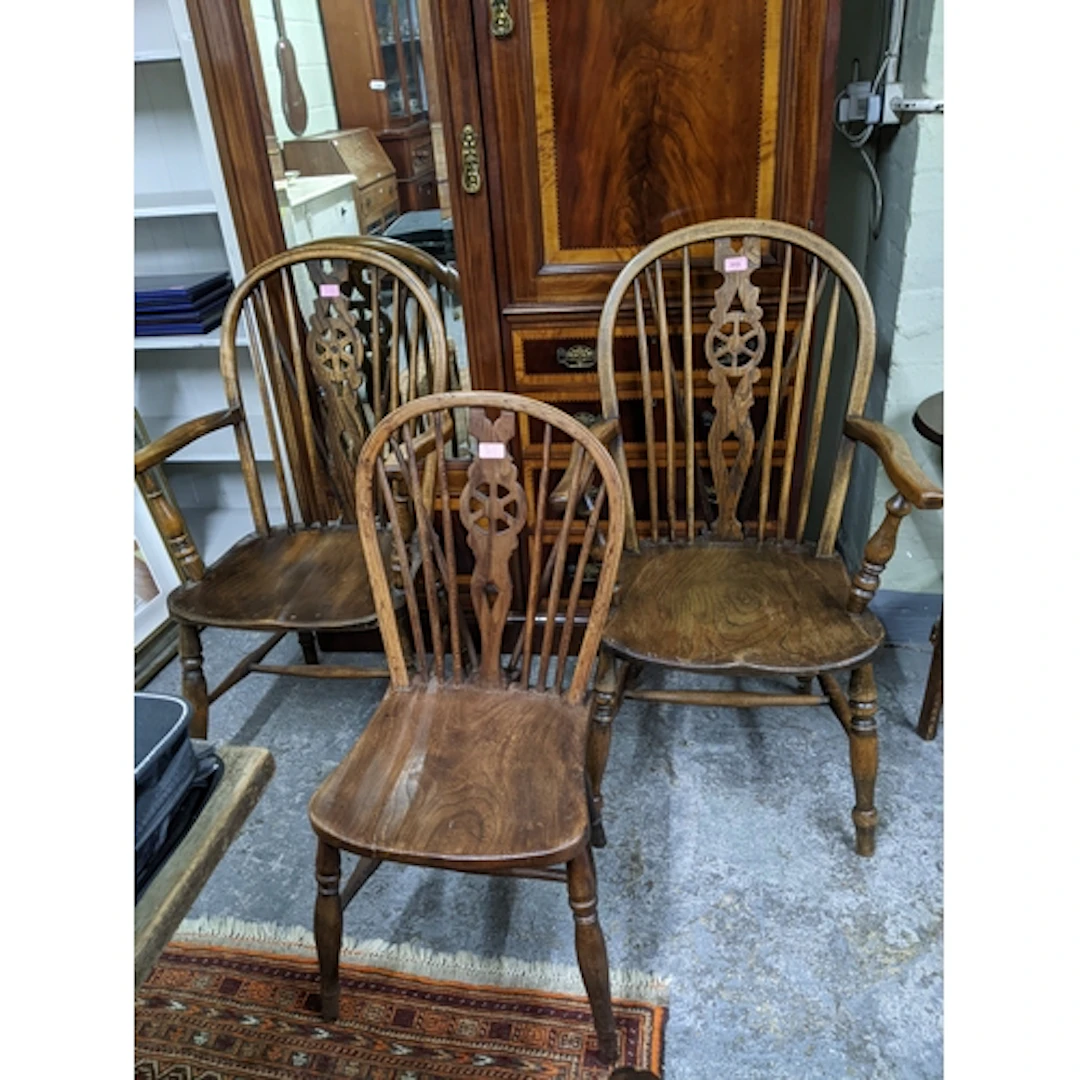 Two 20th century Windsor wheel back carver chairs, elm seats...