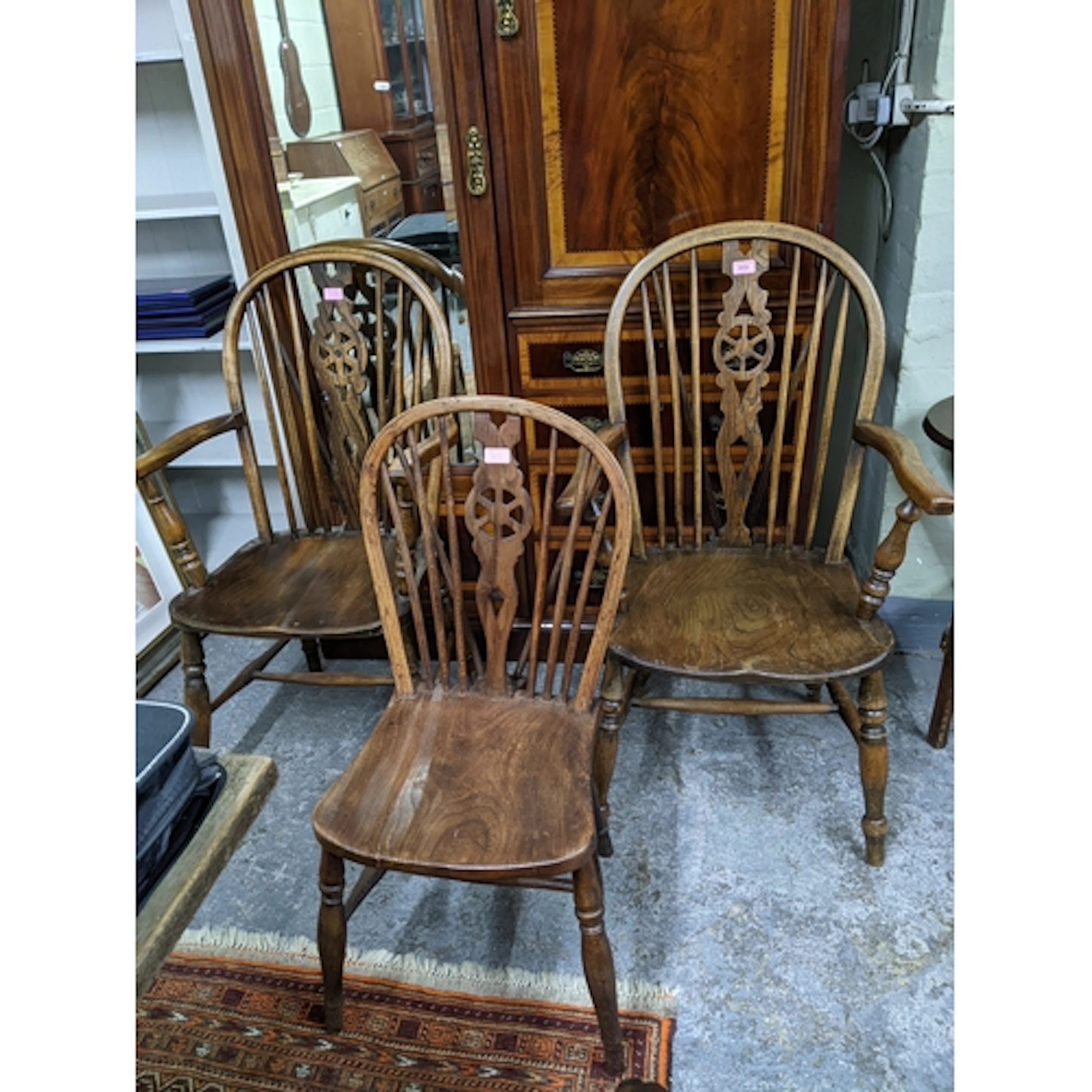 Two 20th century Windsor wheel back carver chairs, elm seats...