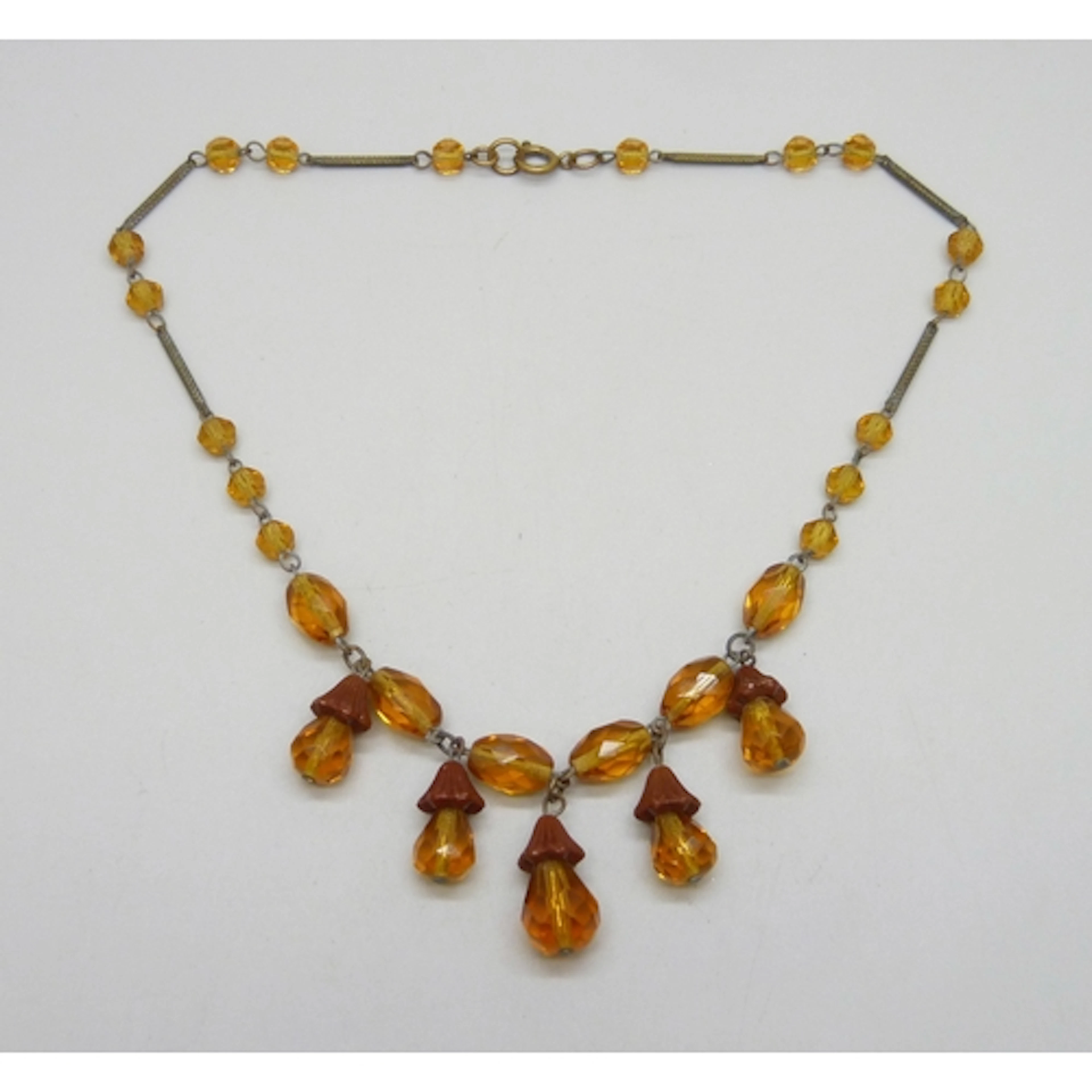 A vintage amber colour glass drop necklace, 35.5cm