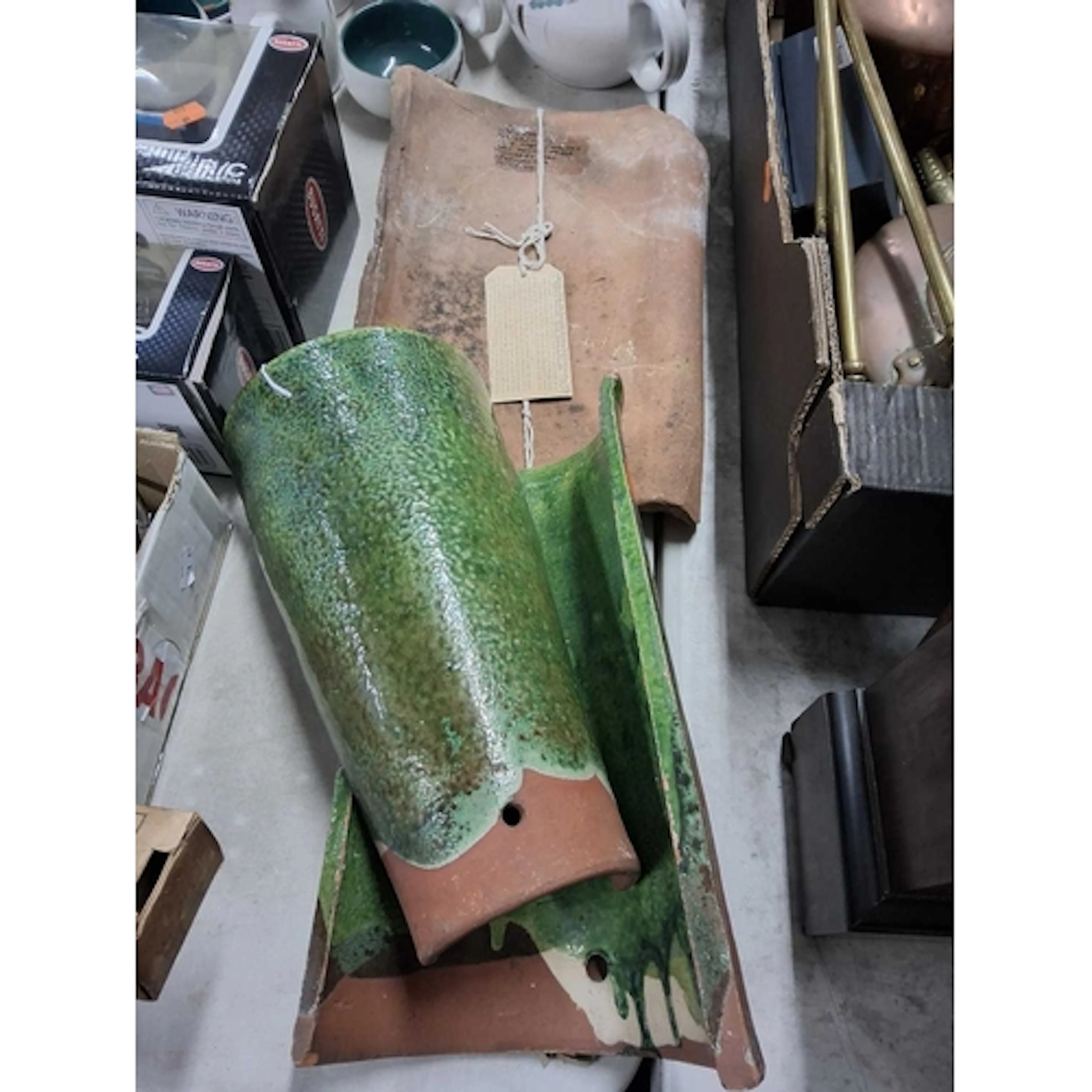 A GROUP OF THREE ROOF TILES two of which are green glazed an...