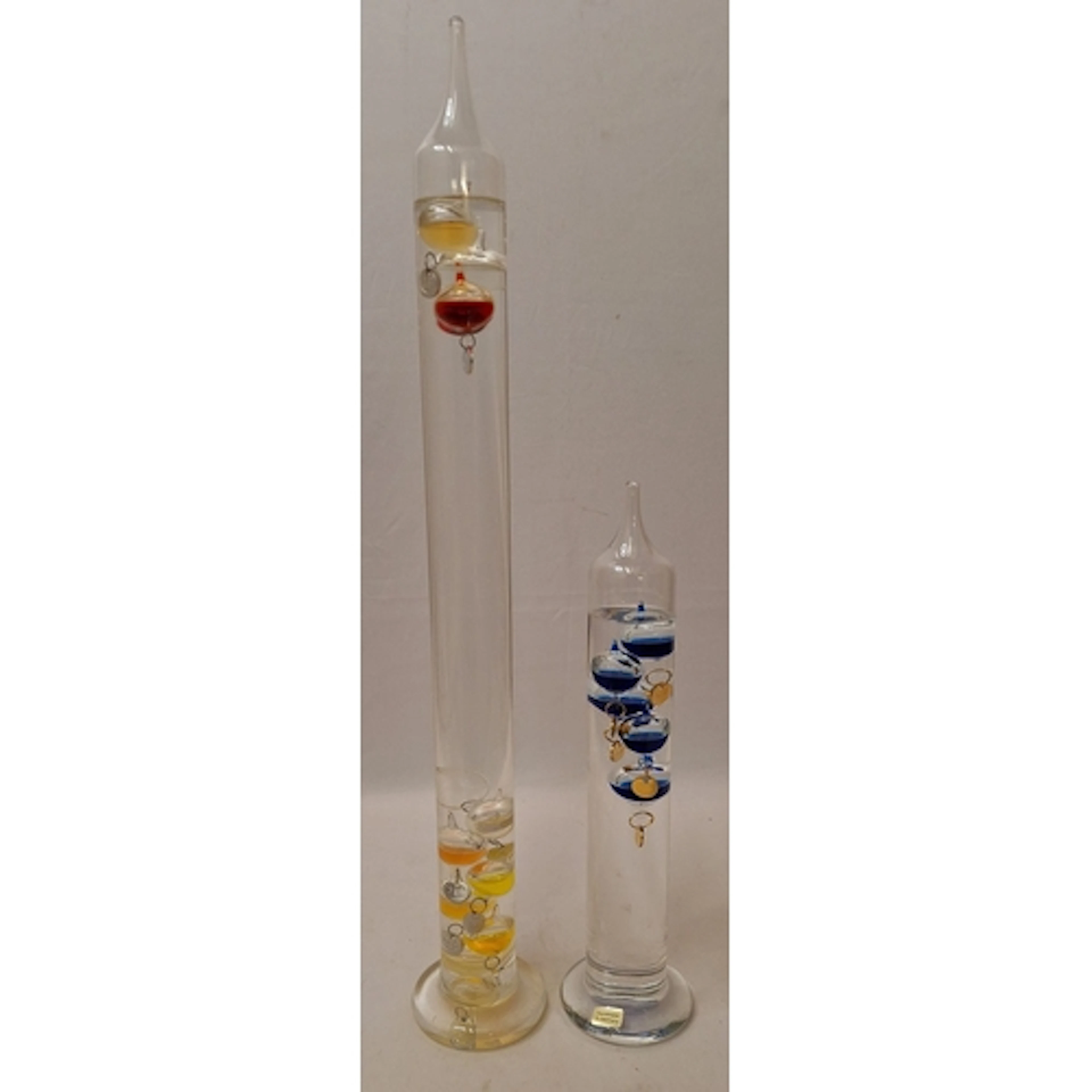 2 Galileo Thermometers, 1 marked handmade in Germany in blue...