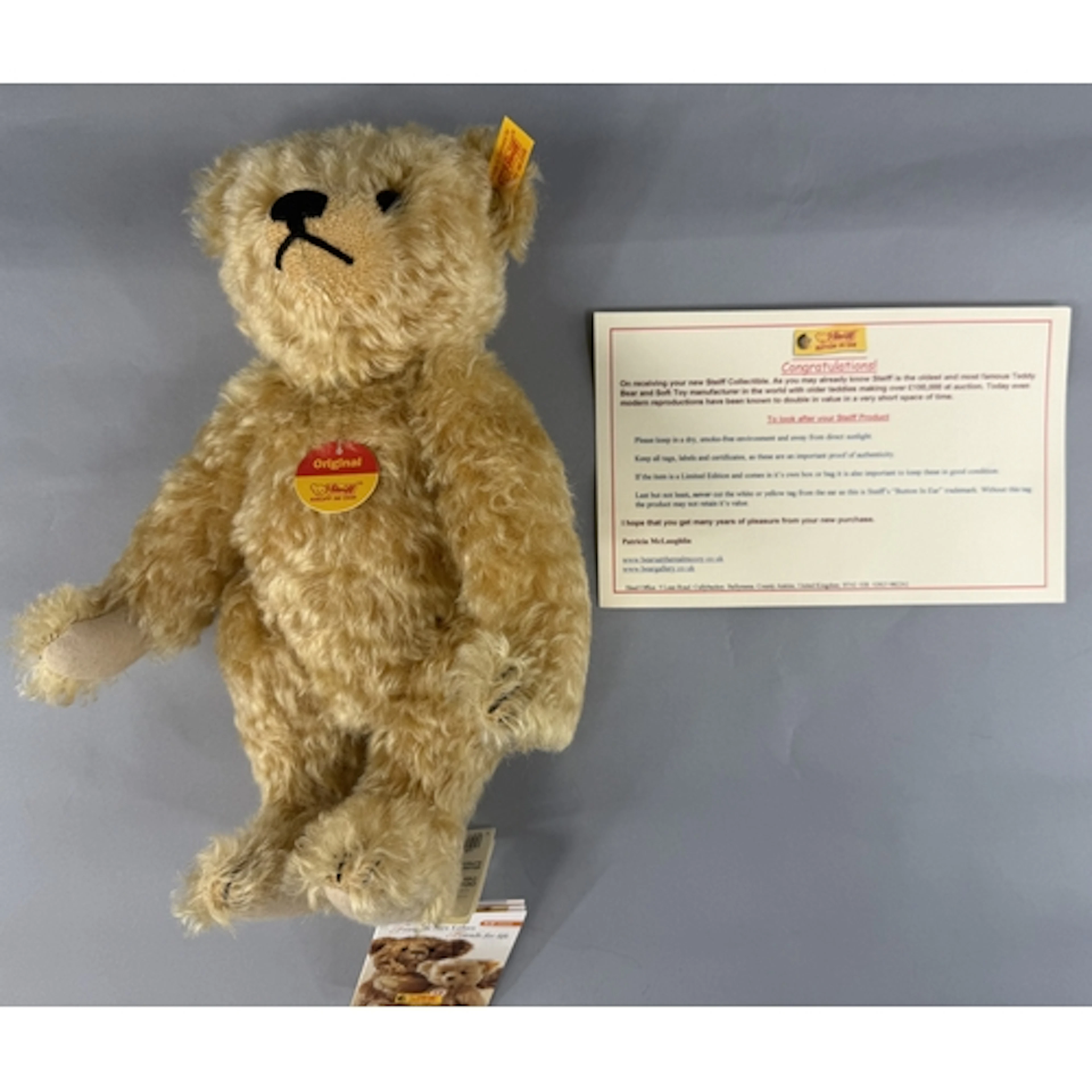 Toys: a Steiff blonde mohair teddy bear, 30cm, complete with...
