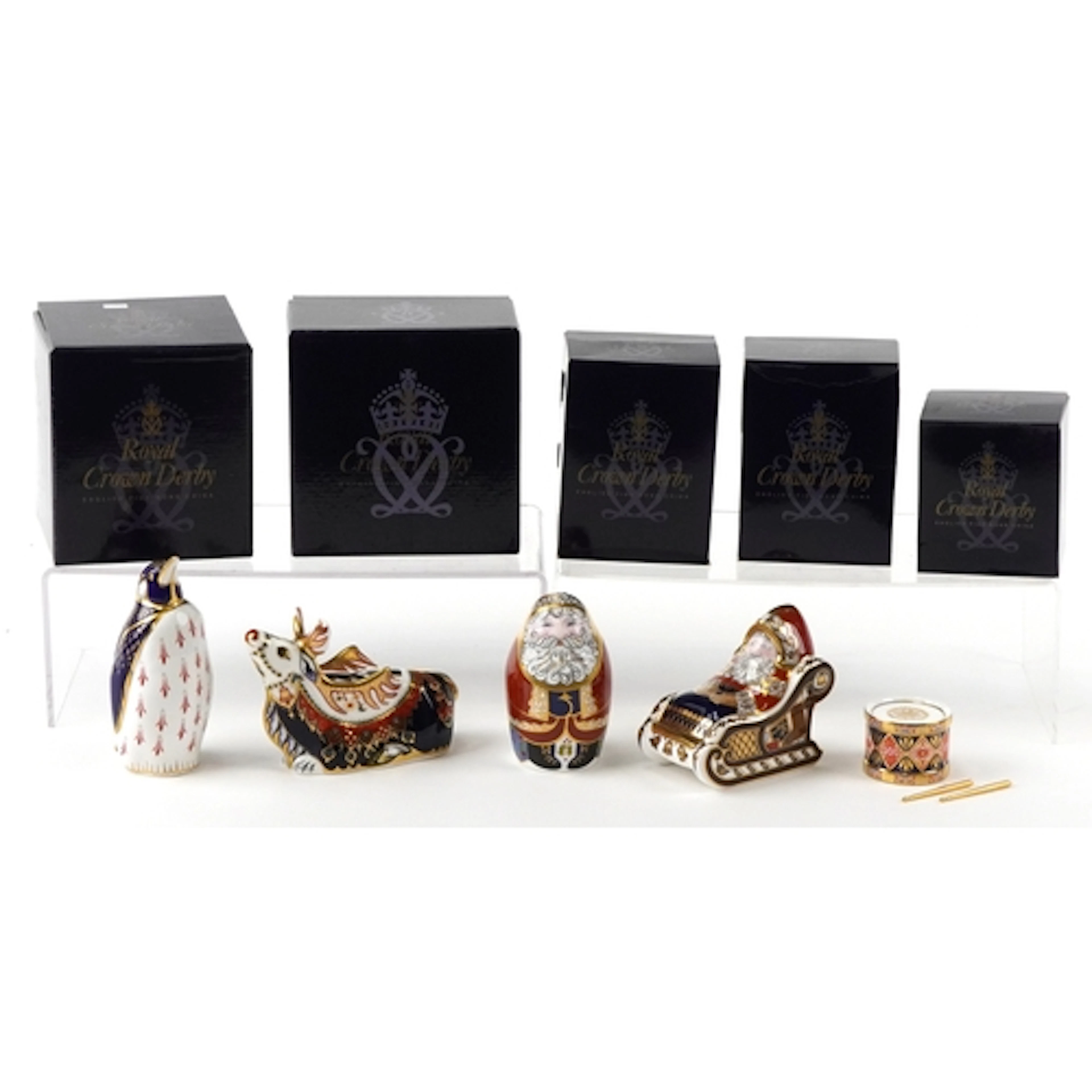 Five Royal Crown Derby paperweights comprising two Santa Cla...