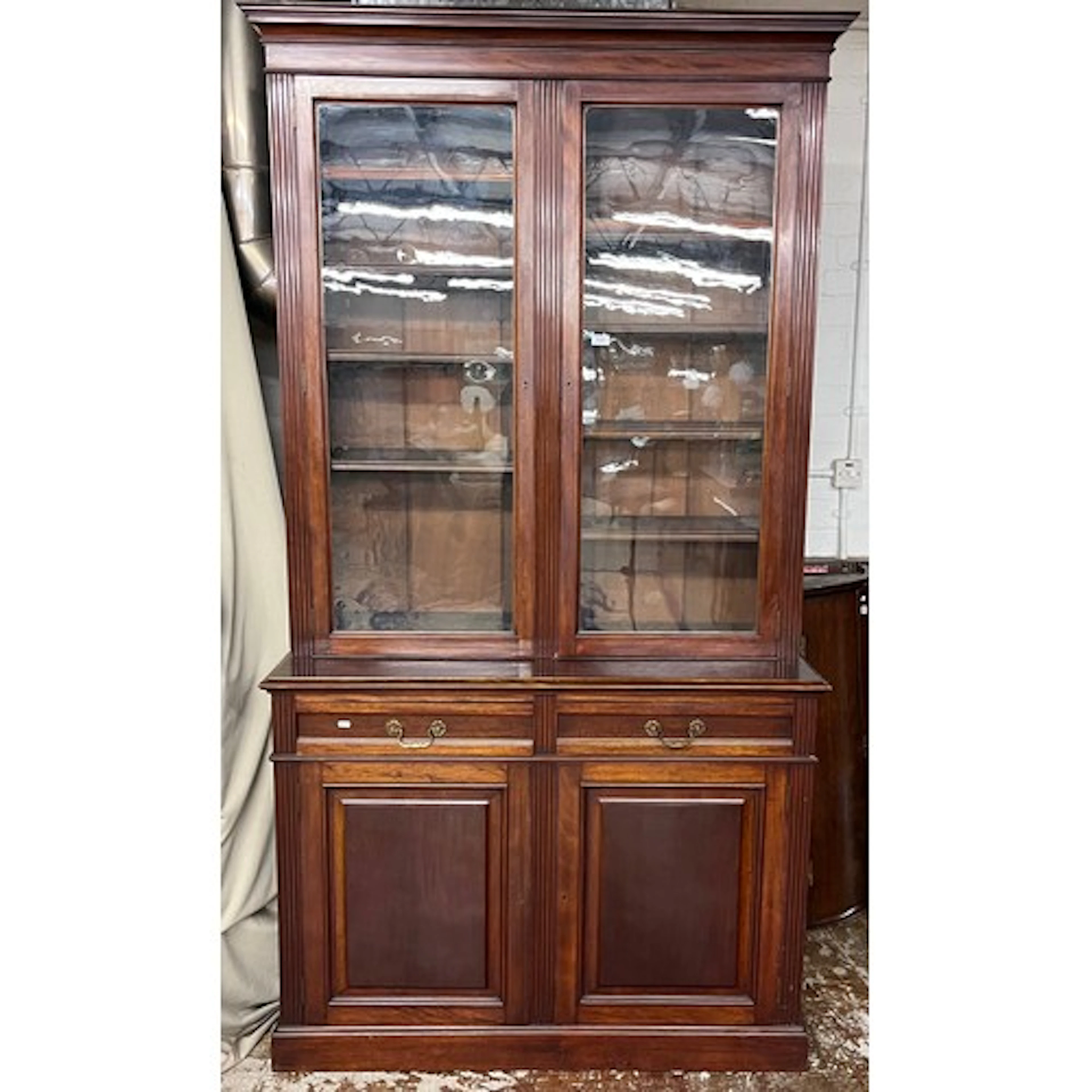 Edwardian cabinet bookcase, the upper section enclosed by tw...