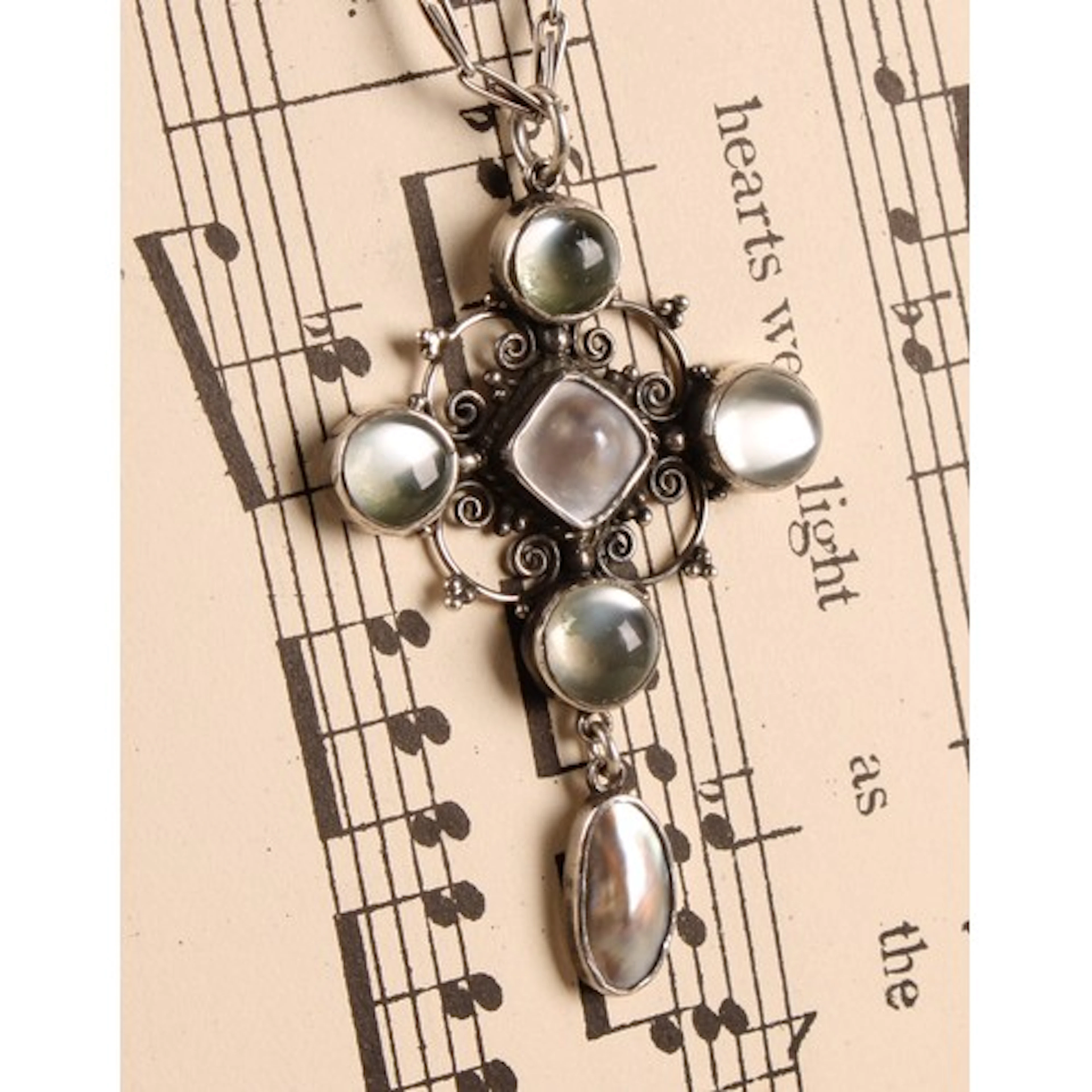 An Arts and Crafts silver, moonstone and mother of pearl pen...
