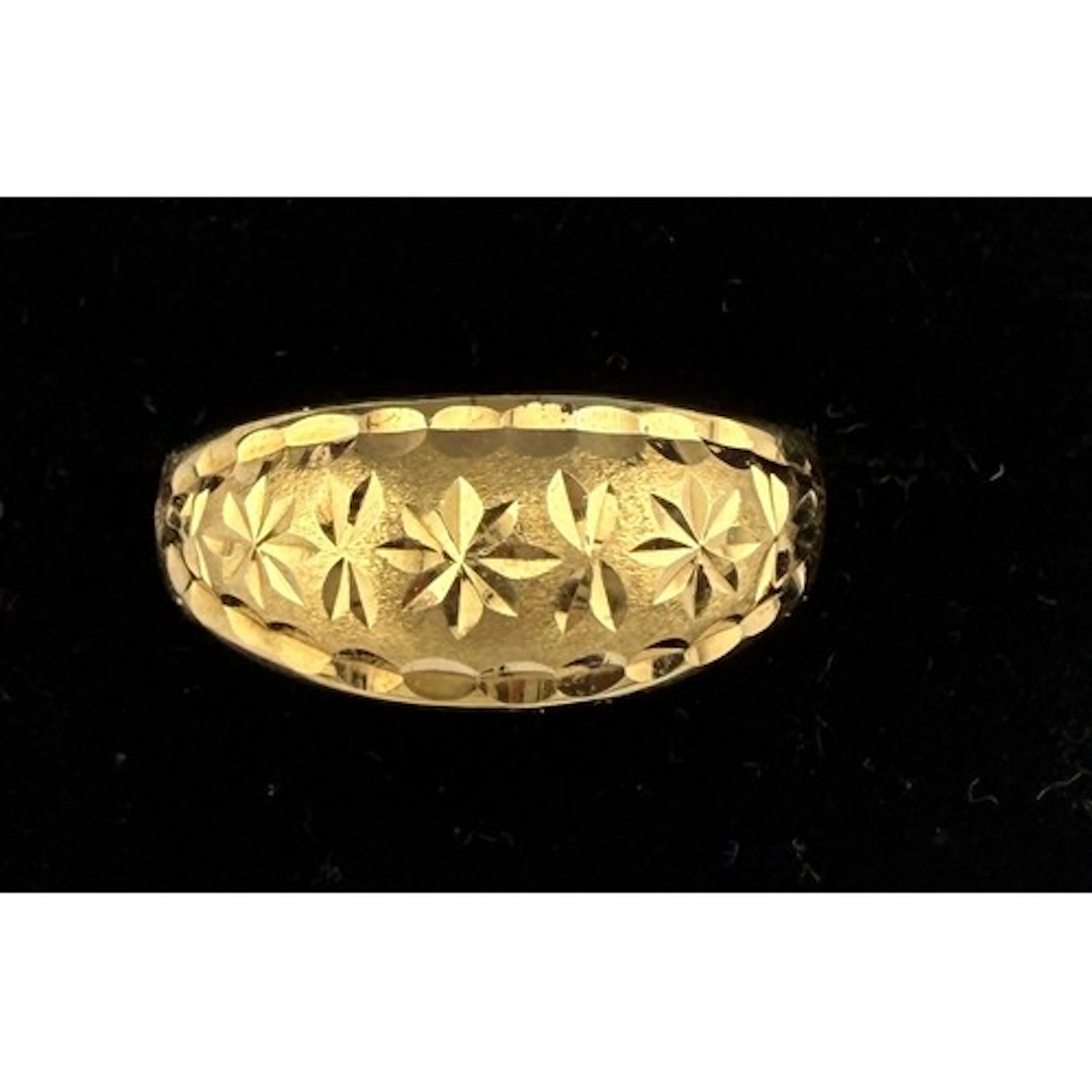 A yellow metal ring, tests as approximately 21 carat gold. S...