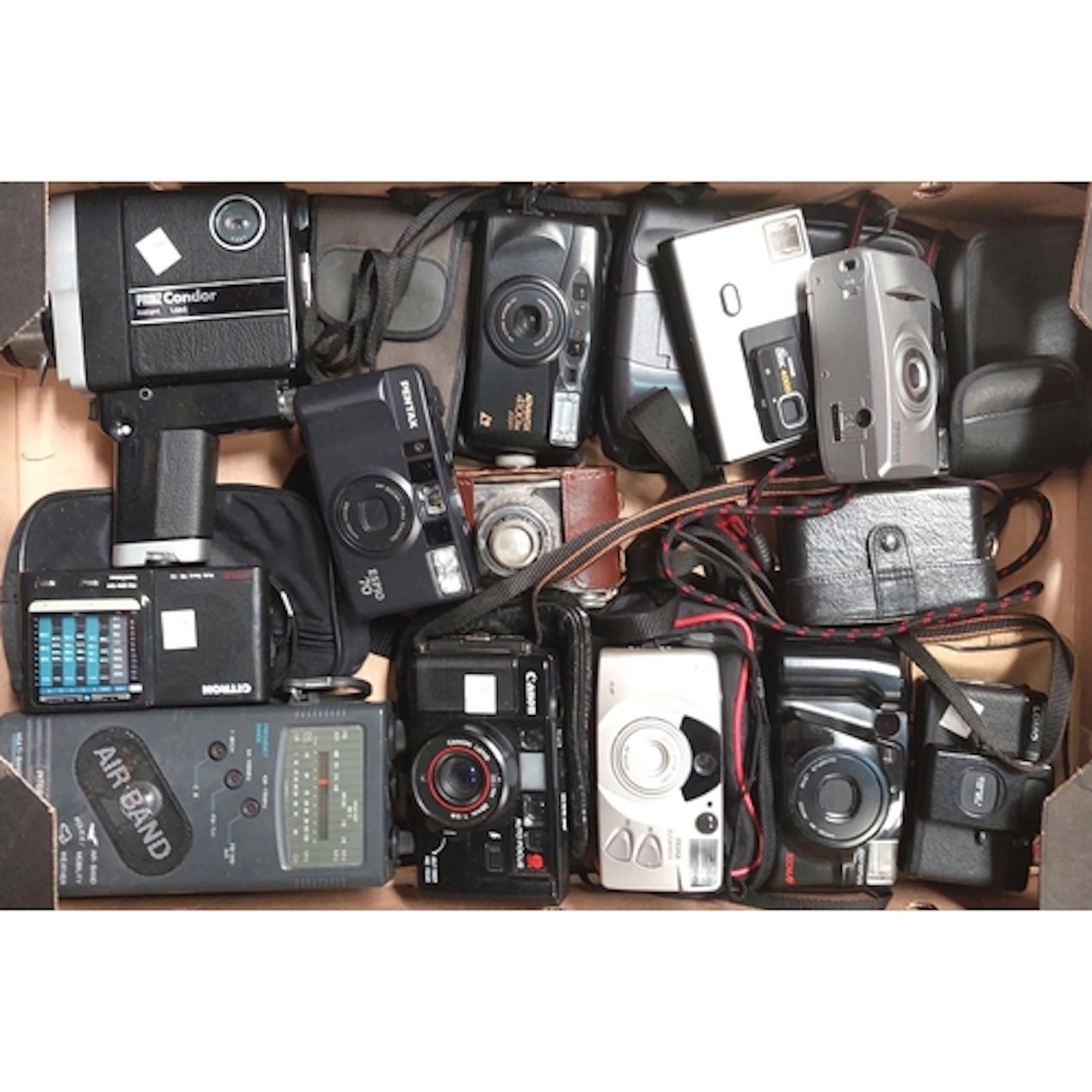 A collection of cameras inc. Canon, Kodak, Printz Condor, Pe...