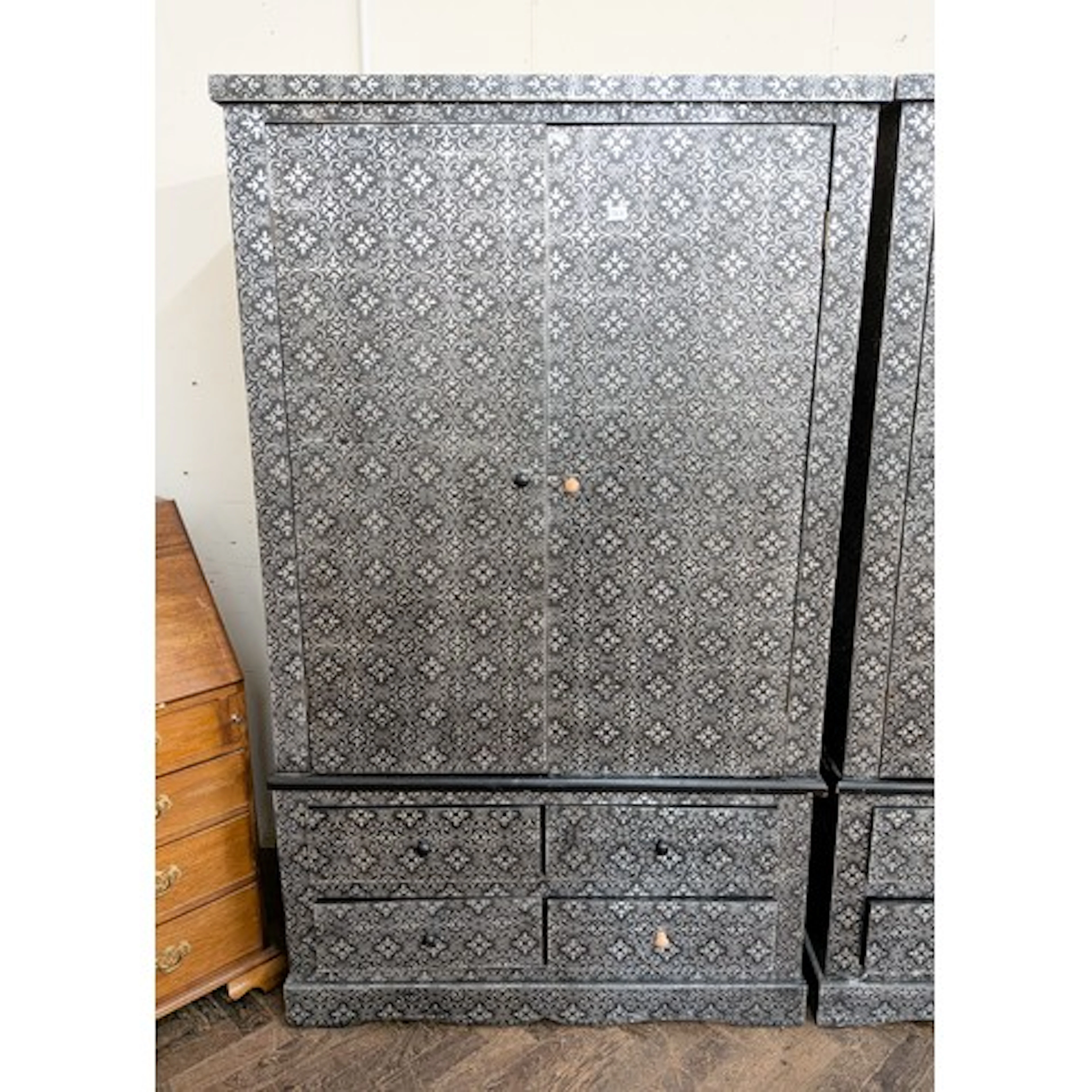 A modern silver and black two door decorated wardrobe standi...