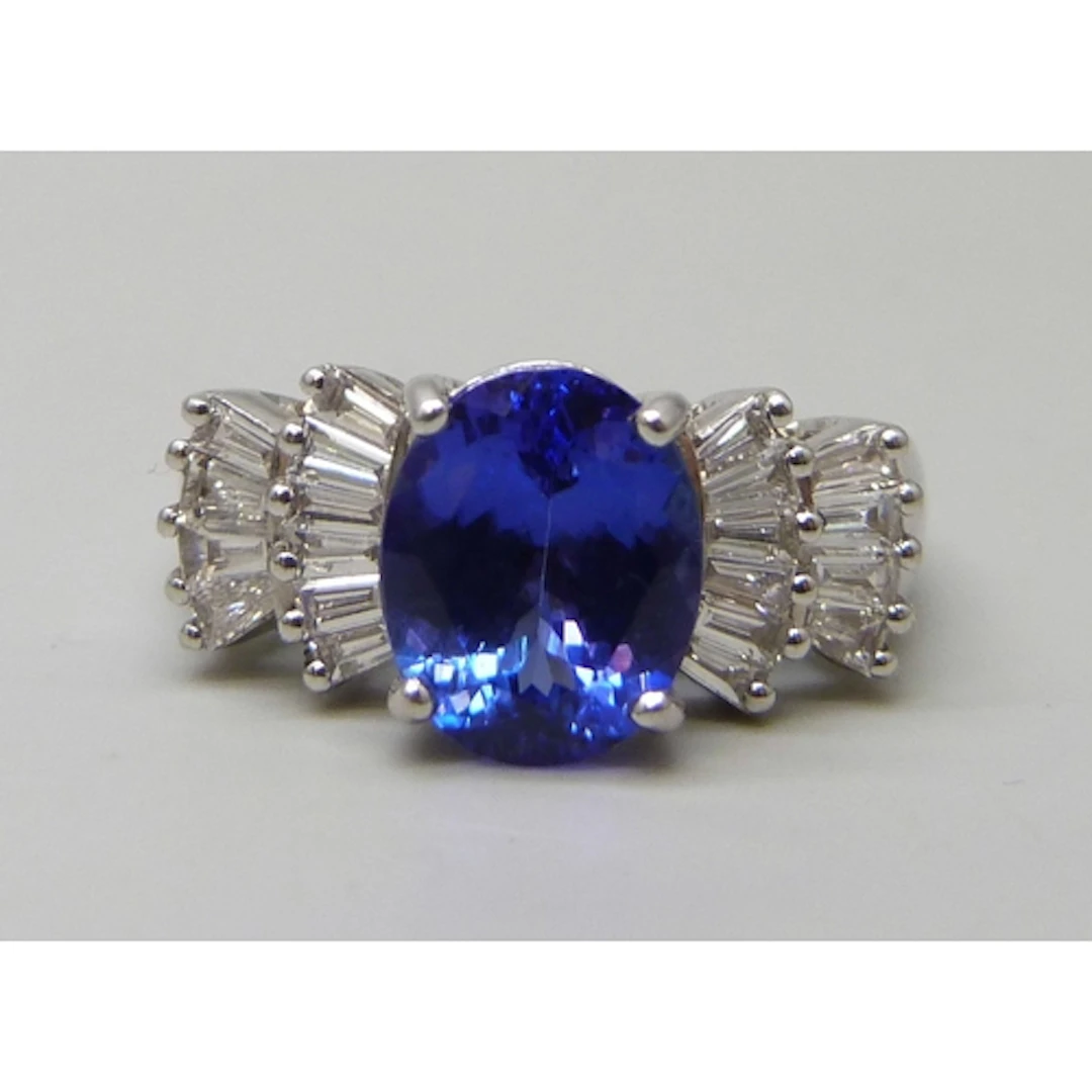 An 18ct white gold, possibly tanzanite, and diamond ring, 5....