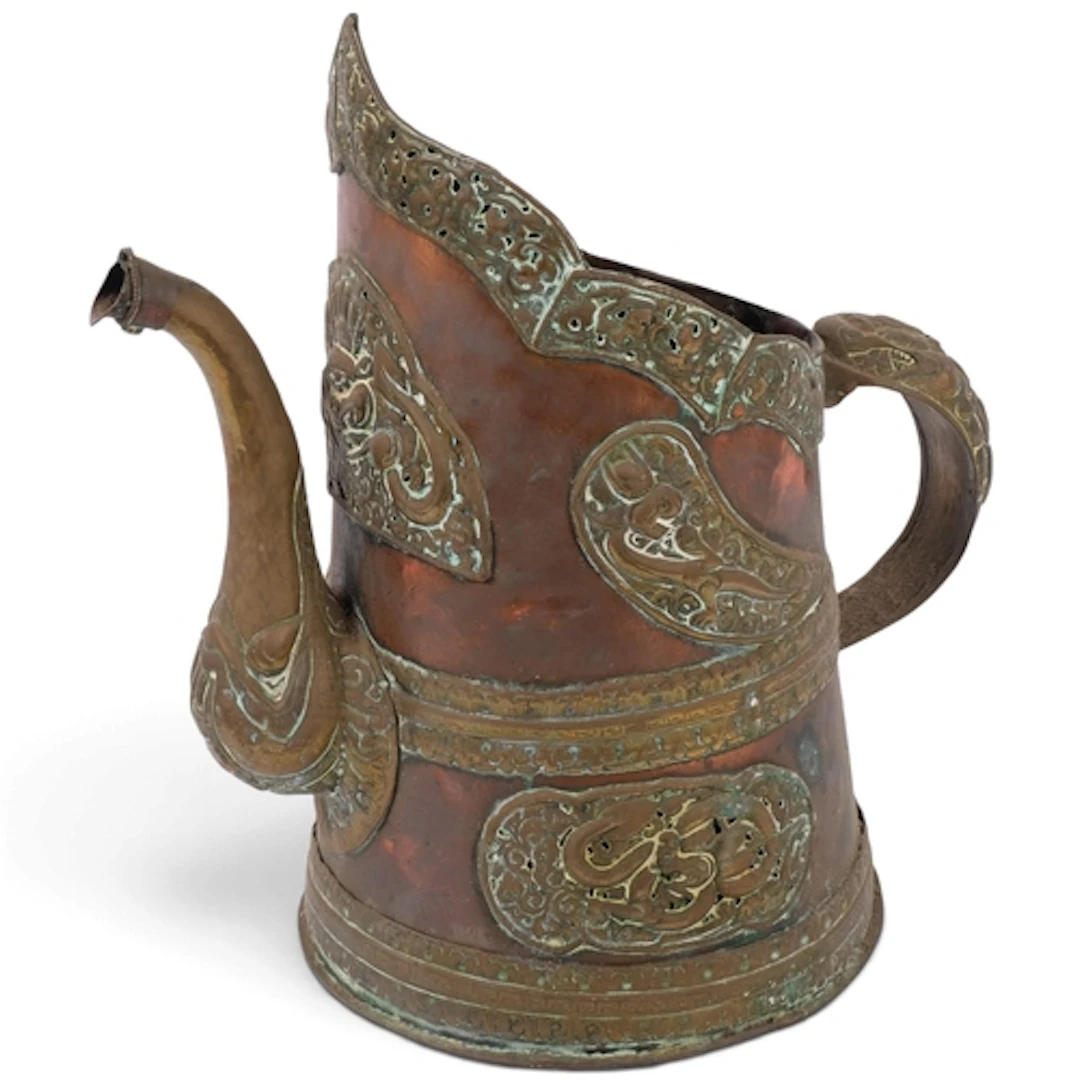 A large Antique Tibetan copper and brass water can, with rel...