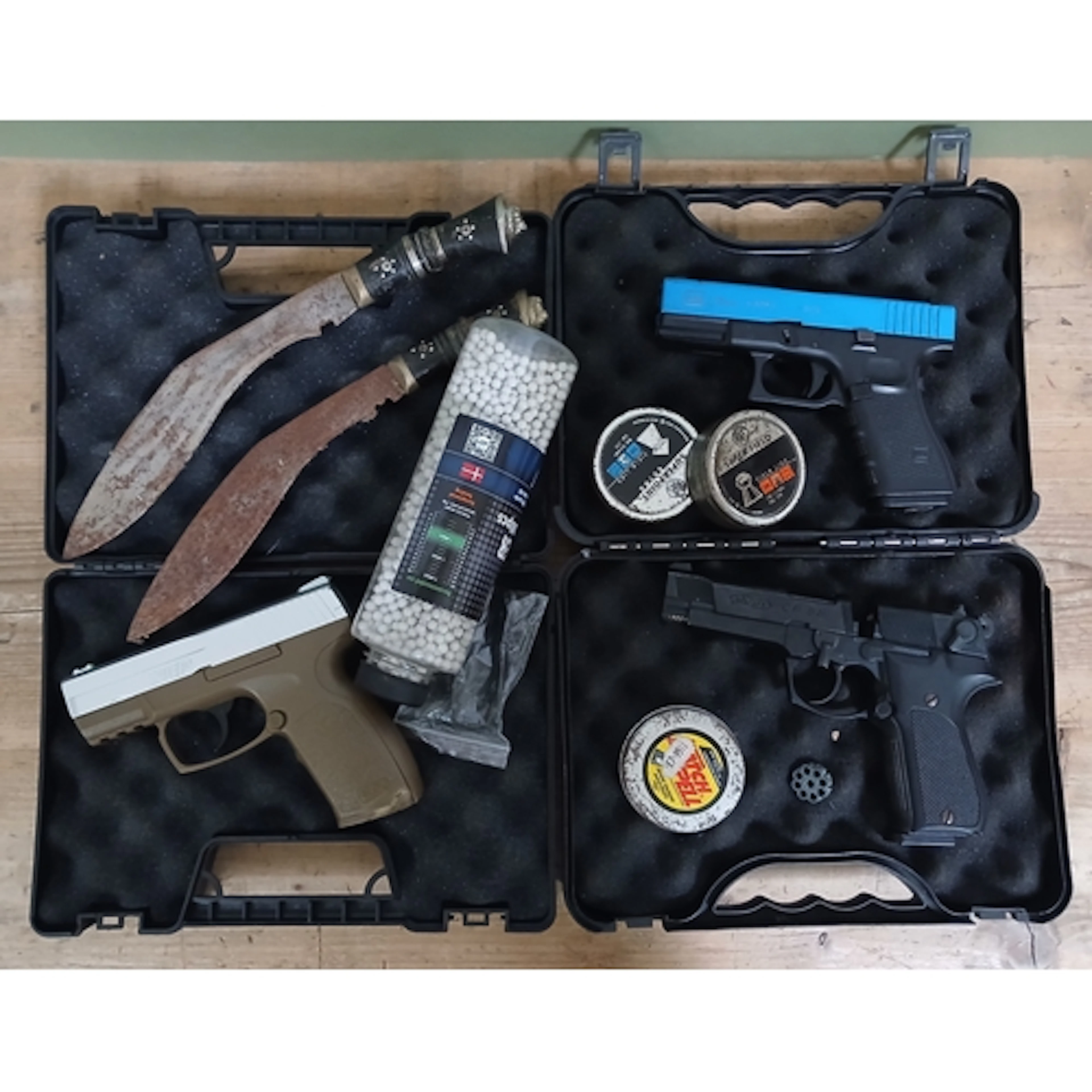 A group of three air pistols, BBs, pellets and two kukri kni...