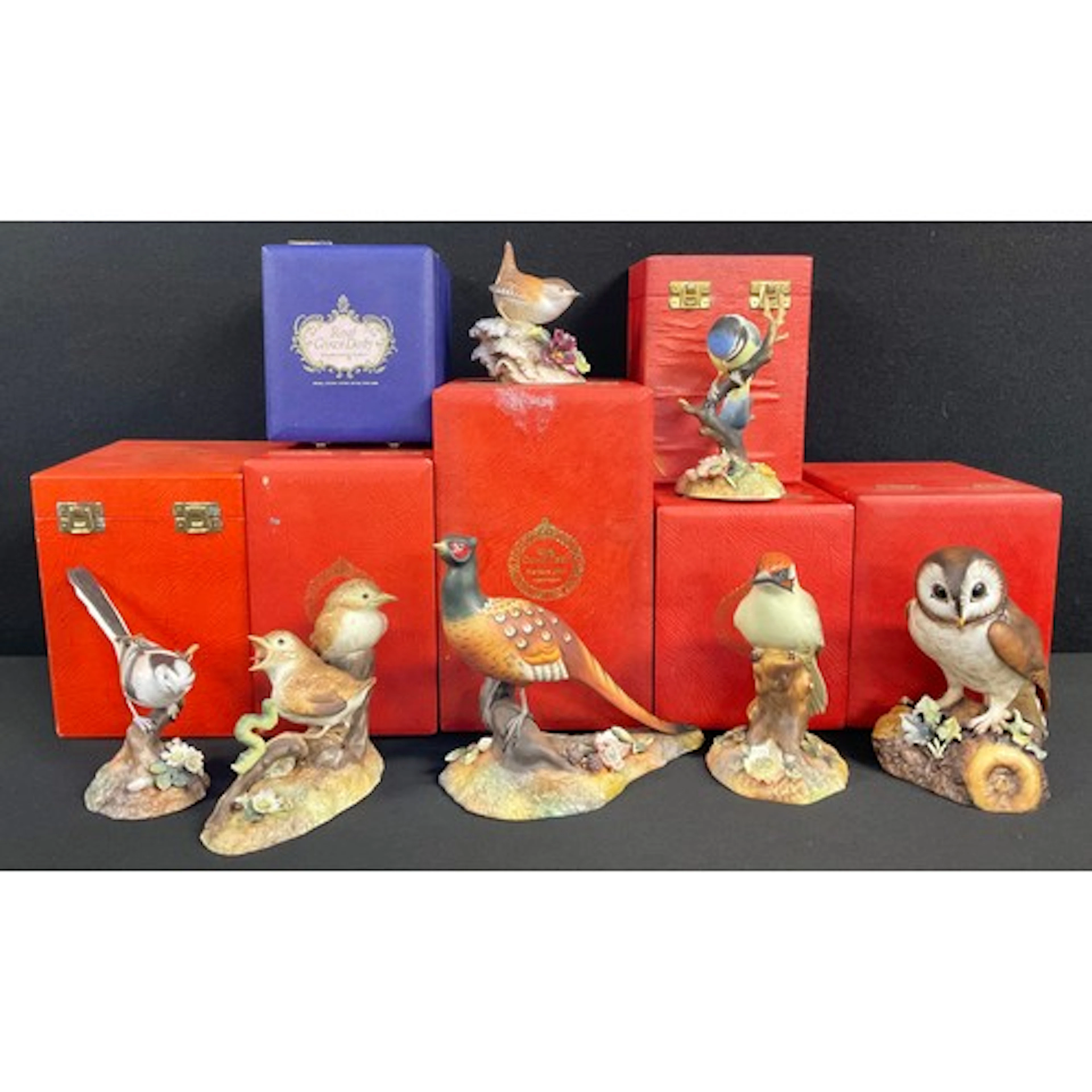 A quantity of Royal Crown Derby hand painted ceramic birds, ...