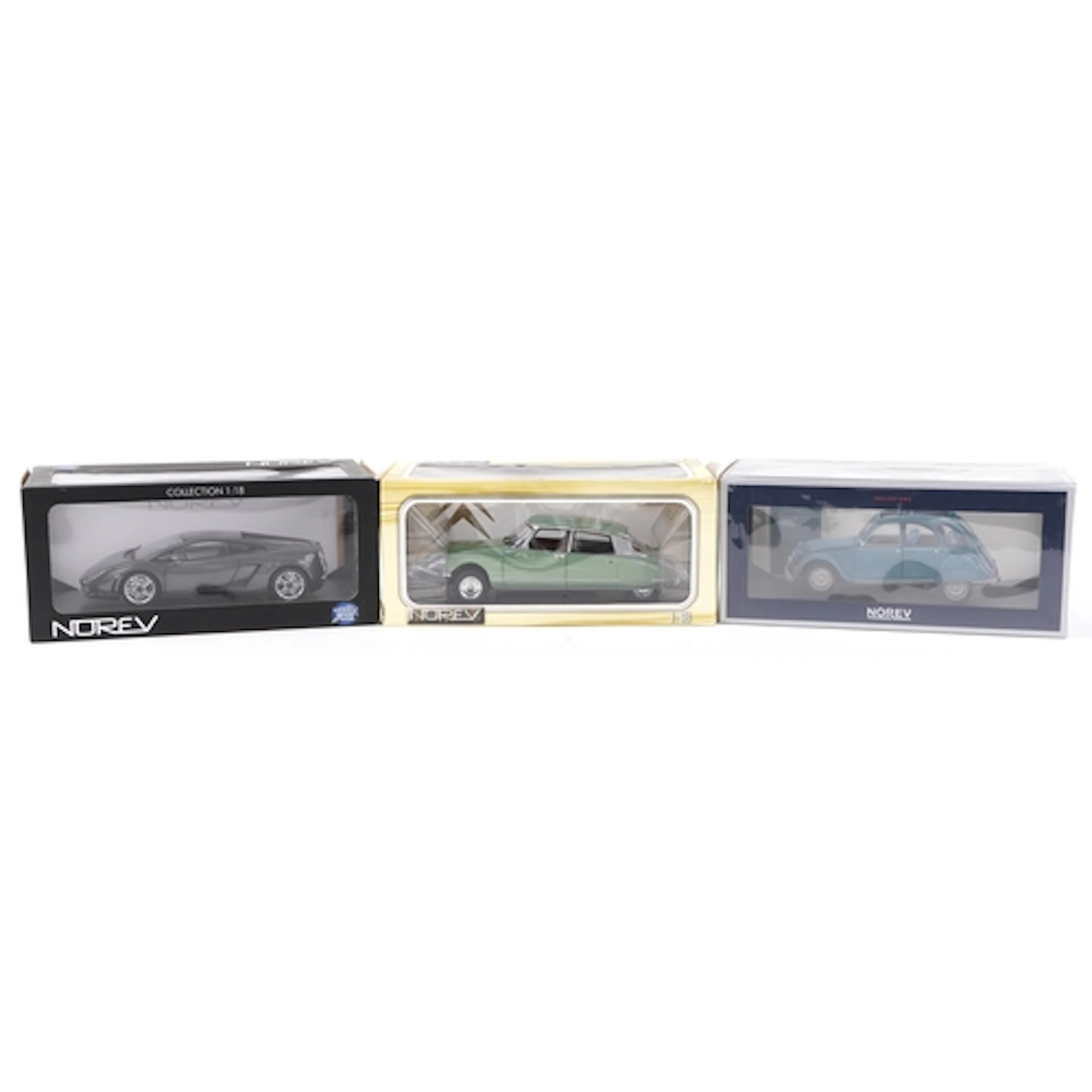 Three Norev 1:18 scale diecast model vehicles with boxes com...