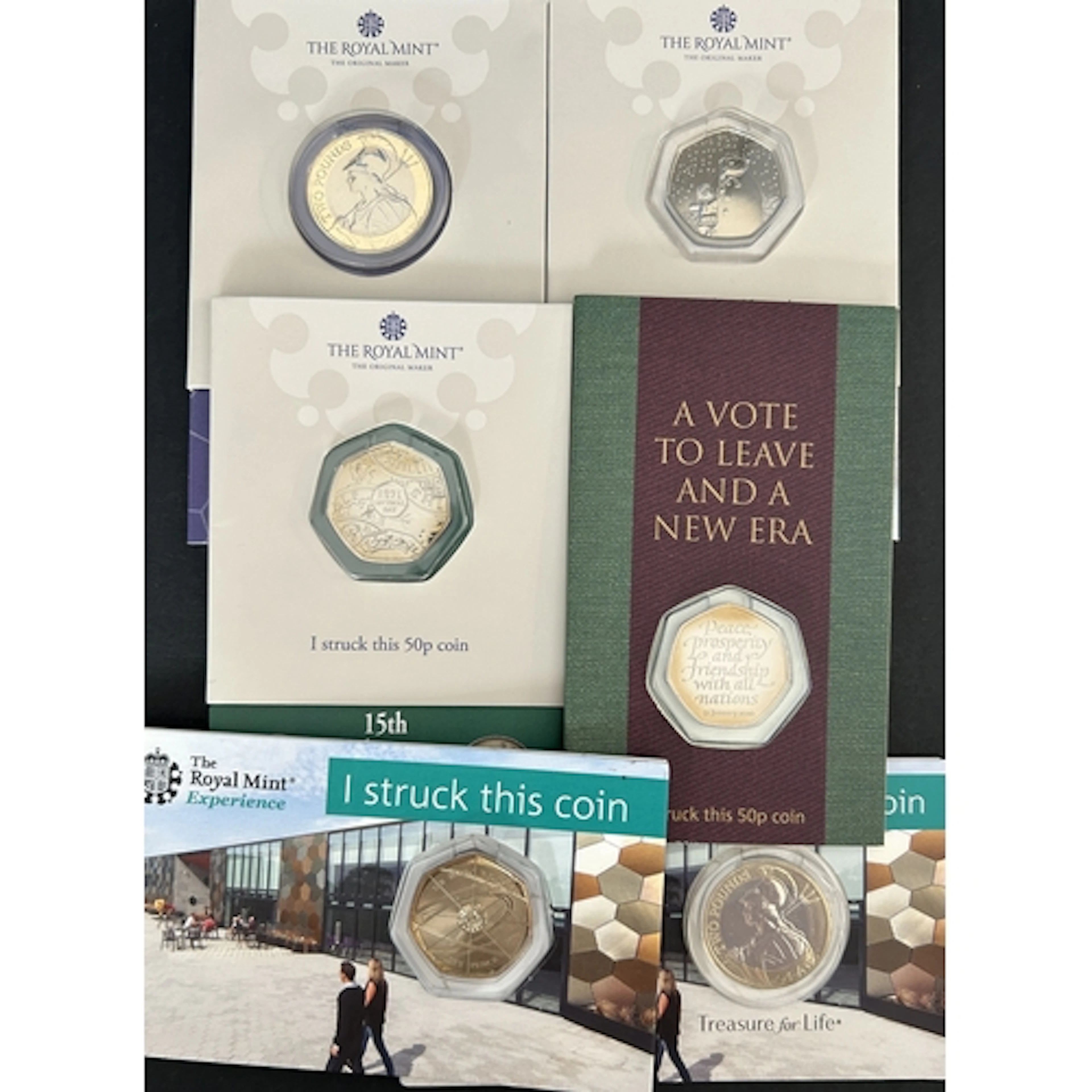 A group of six Royal Mint Experience Strike Your Own cupro-n...