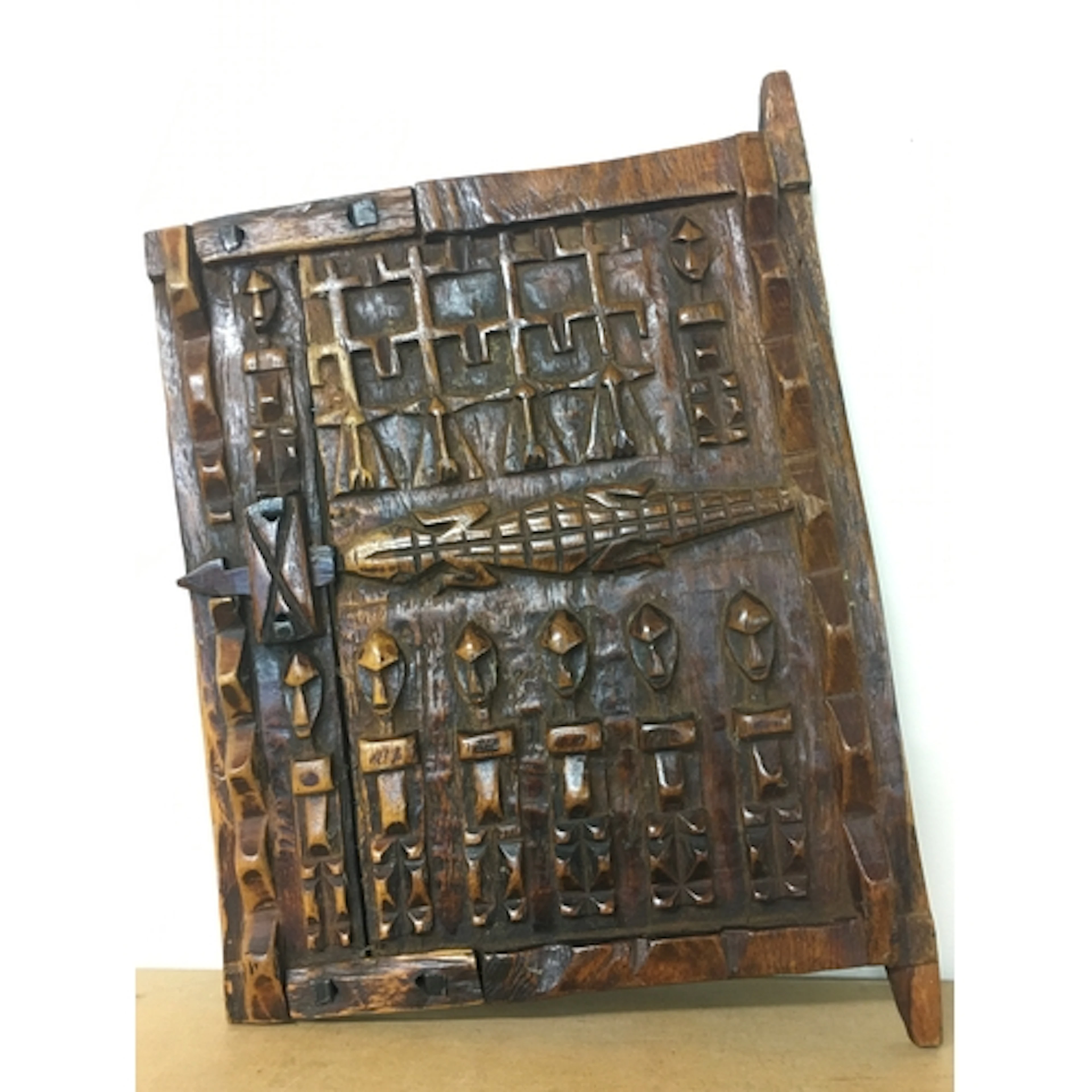 A hand-carved wooden Dogon granary door from Mali, West Afri...