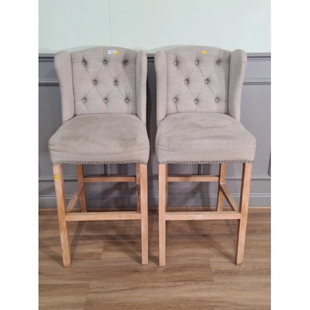 A pair of cream upholstered breakfast bar Stools, (R6).