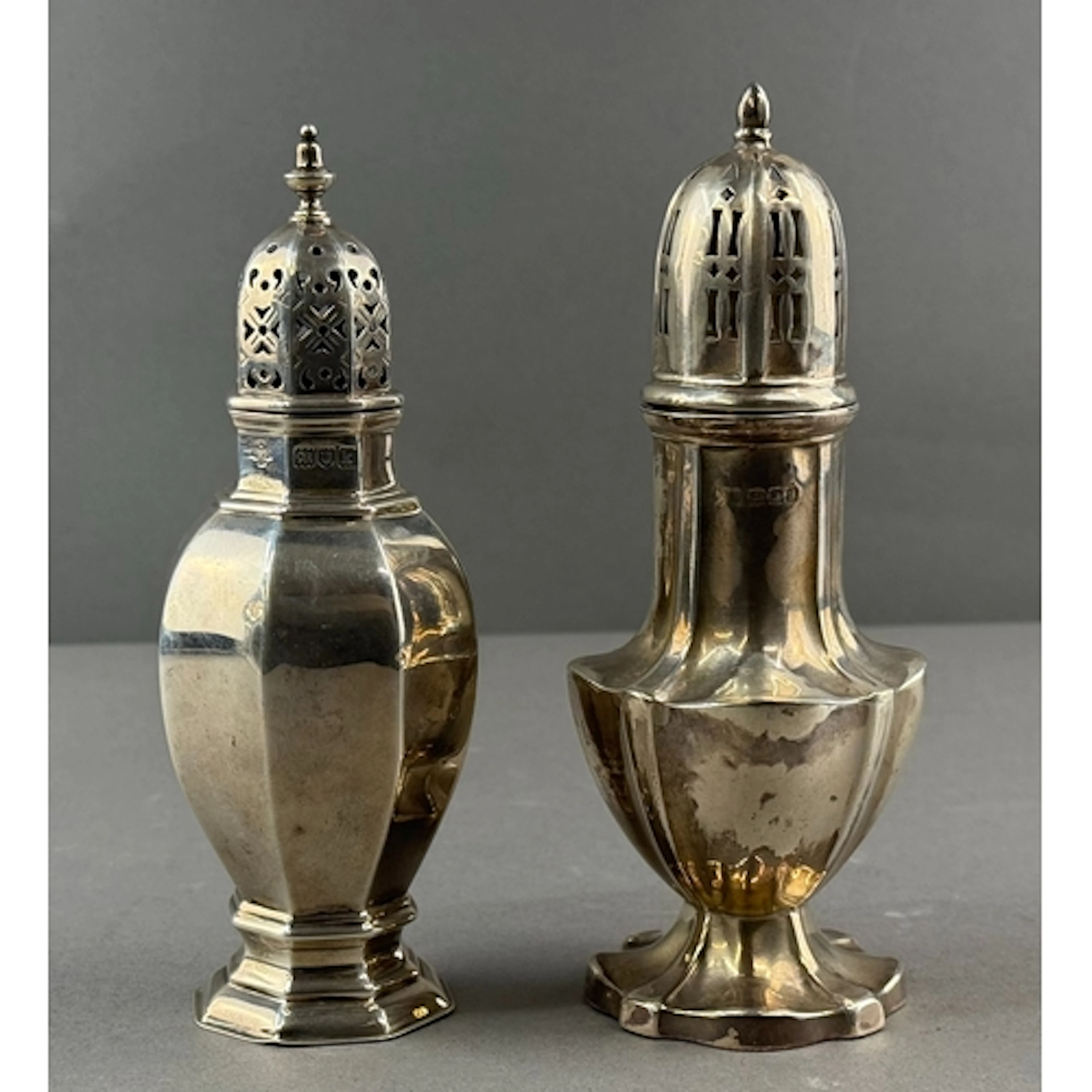 Silver: a sugar caster of tapering bulbous form by Horace Wo...