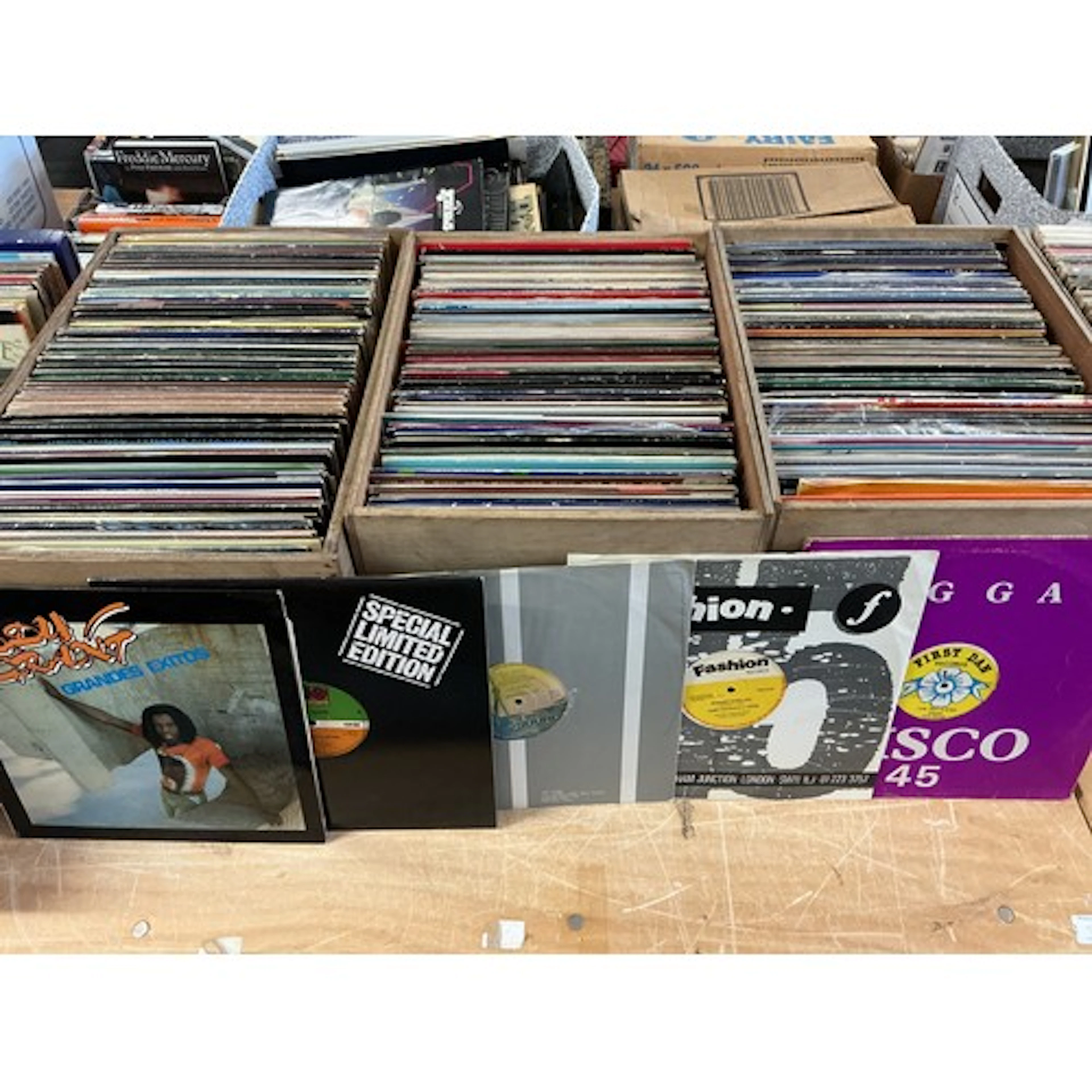 Four boxes containing a large collection of LPs and 12” sing...