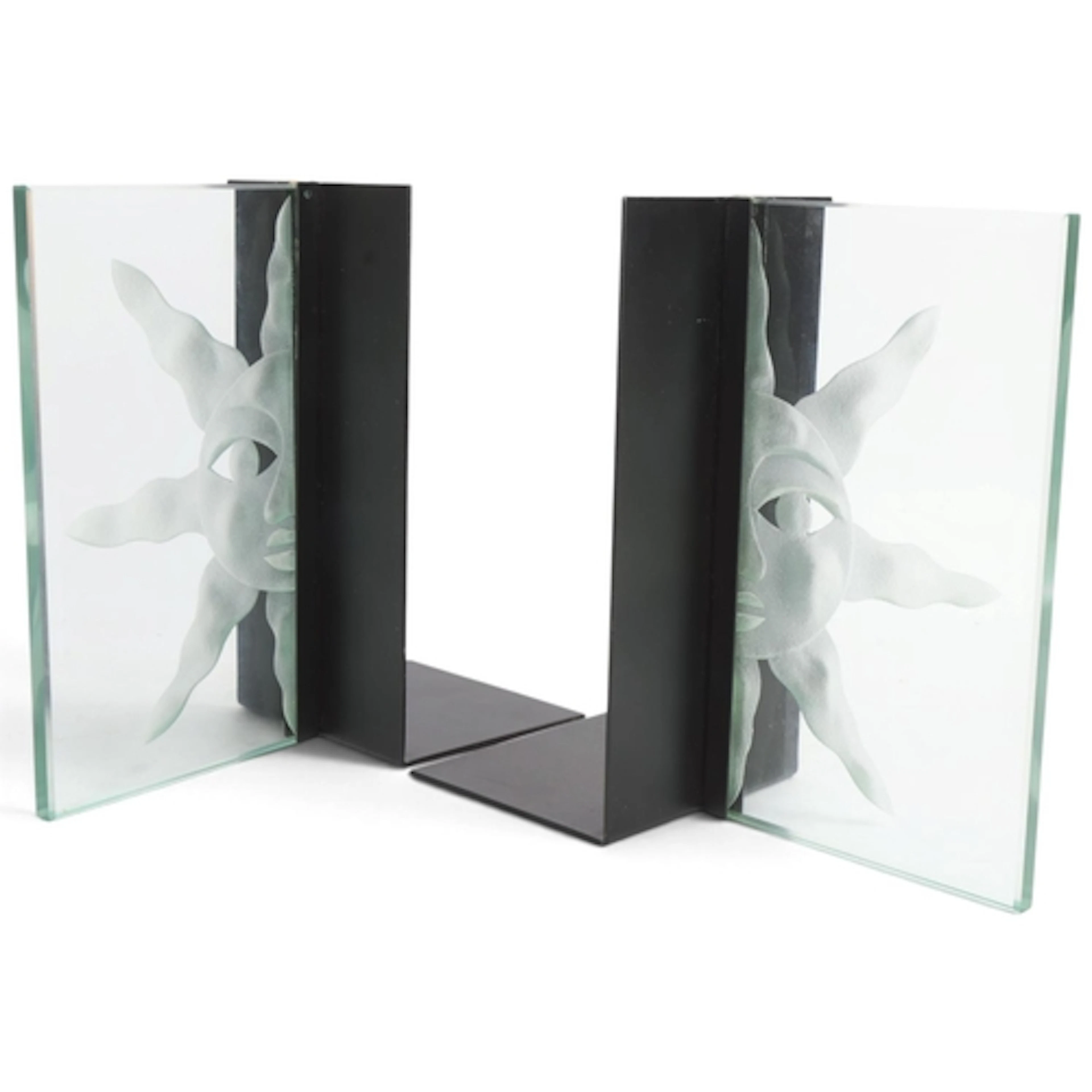 A pair of bookends with frosted glass Sun panel on black ste...