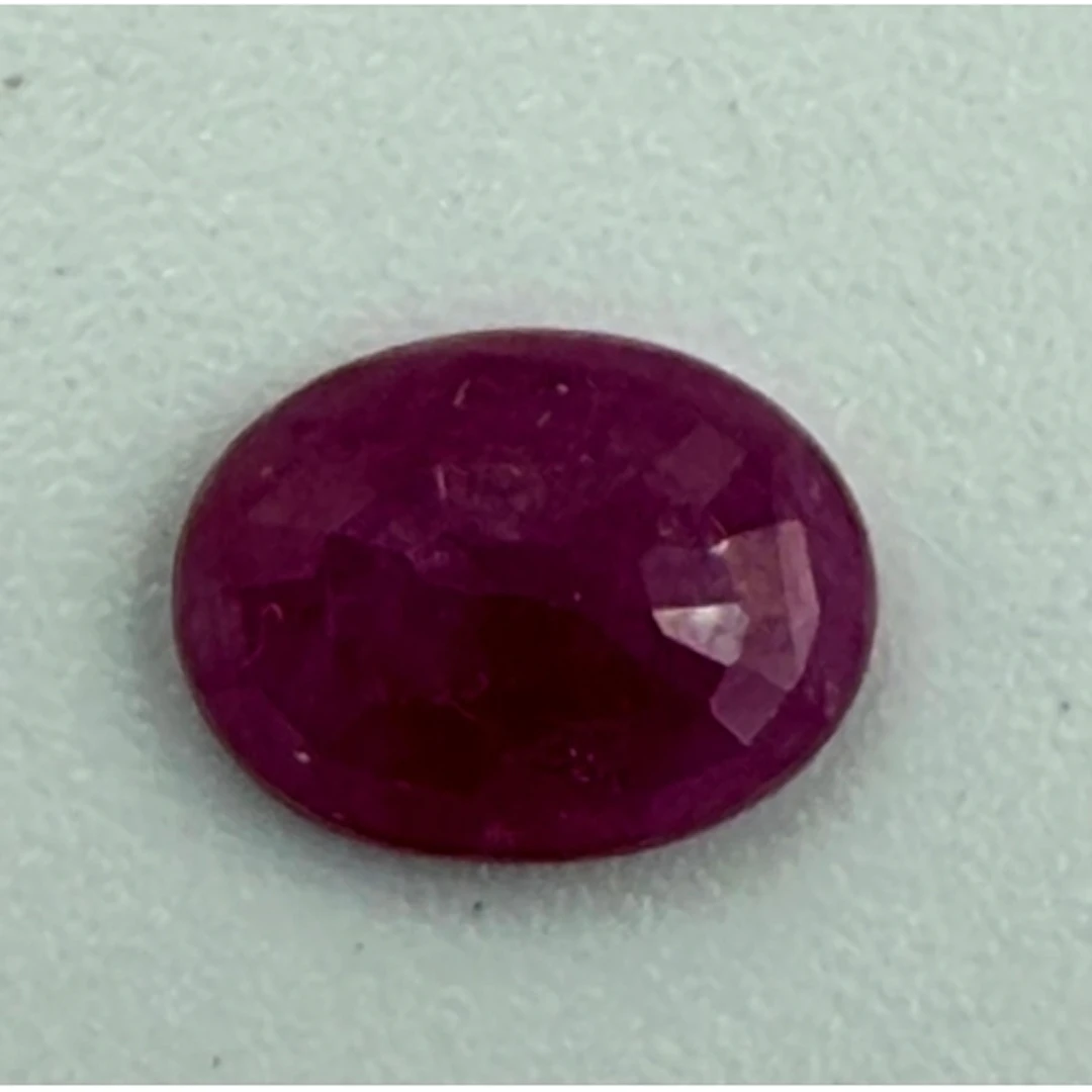 An oval Burmese ruby, 1.29 carats Clarity SI with supporting...