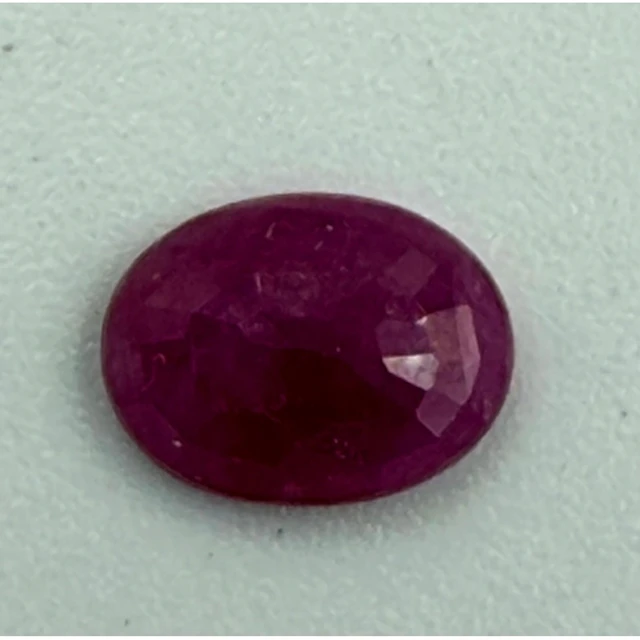 An oval Burmese ruby, 1.29 carats Clarity SI with supporting...