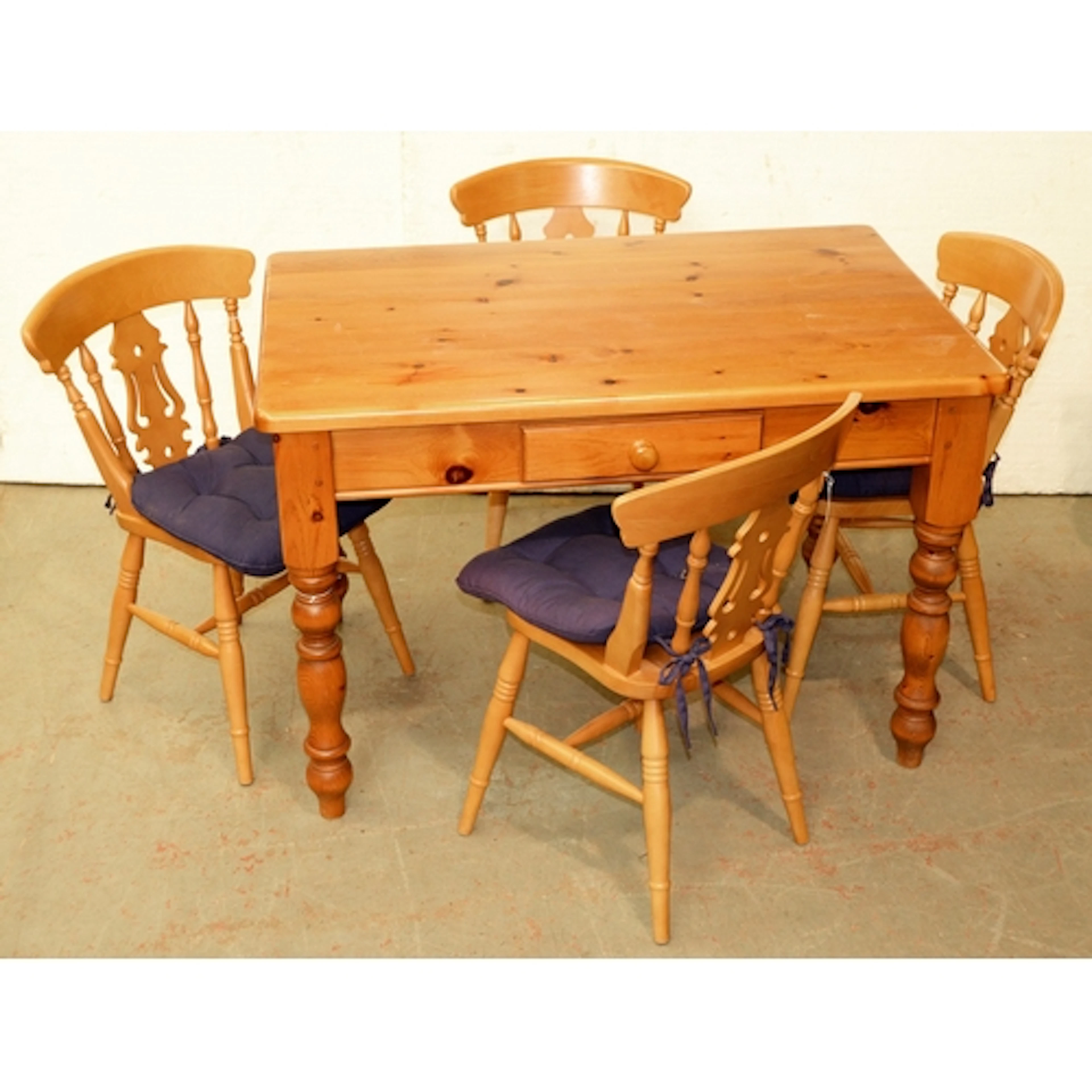 Waxed pine kitchen table fitted with a drawer on turned legs...