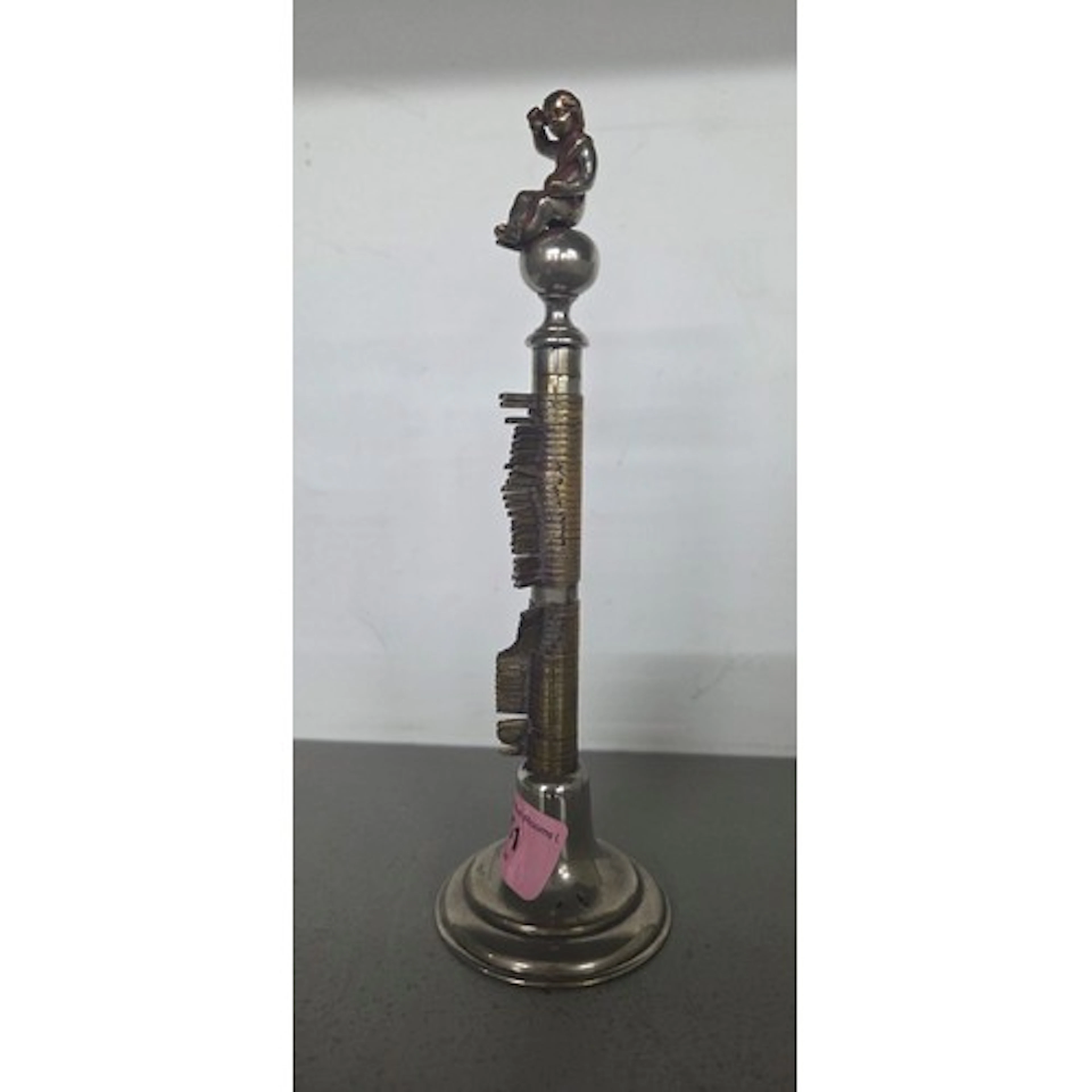 A French silver-plated bronze pen holder, having a circular ...