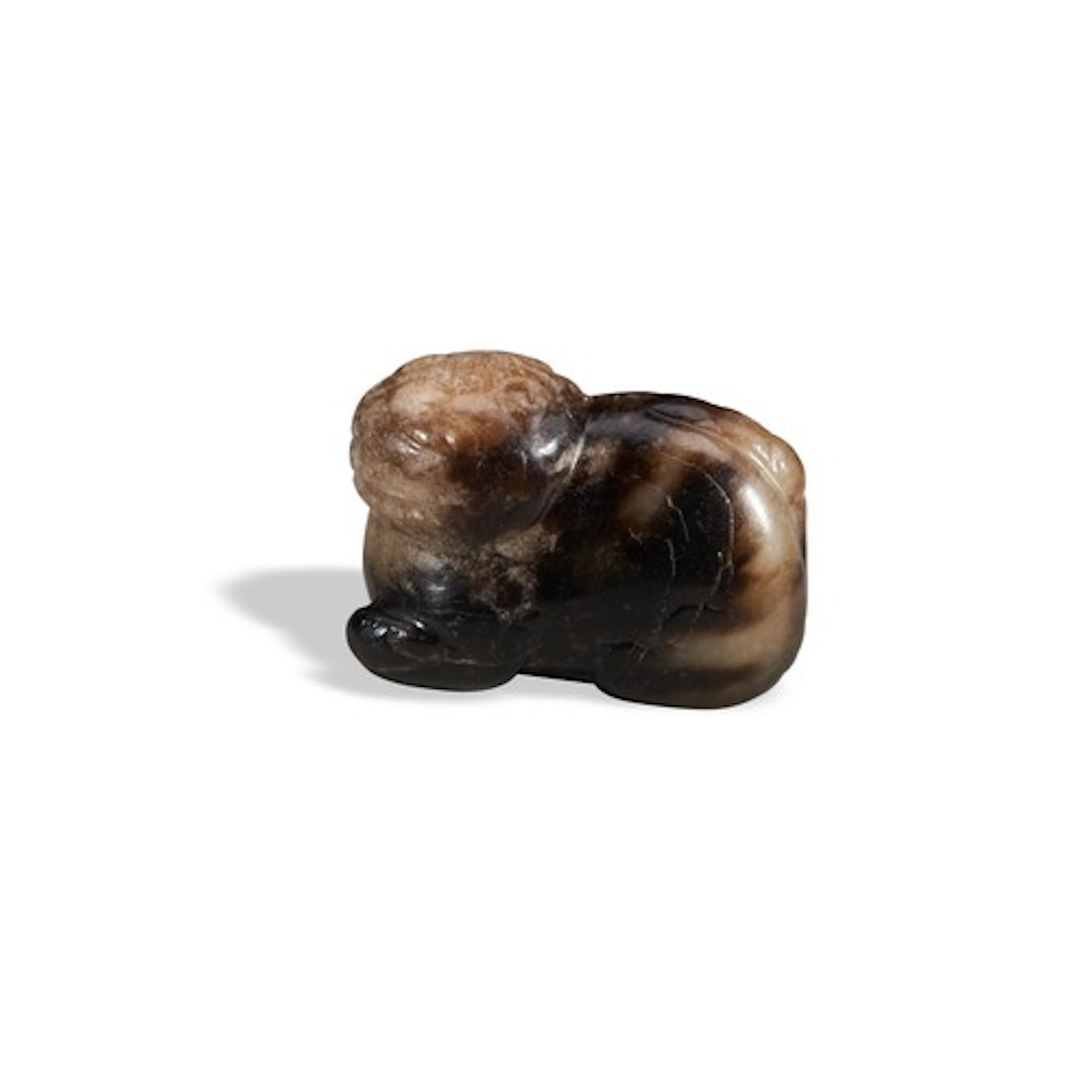 A MOTTLED BLACK AND CRAMEL JADE LION MING DYNASTY (1368-164...
