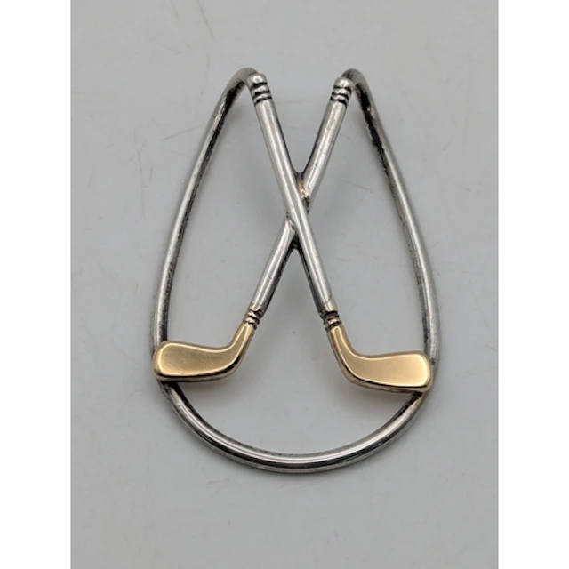 A sterling silver and 18ct yellow gold money clip featuring ...