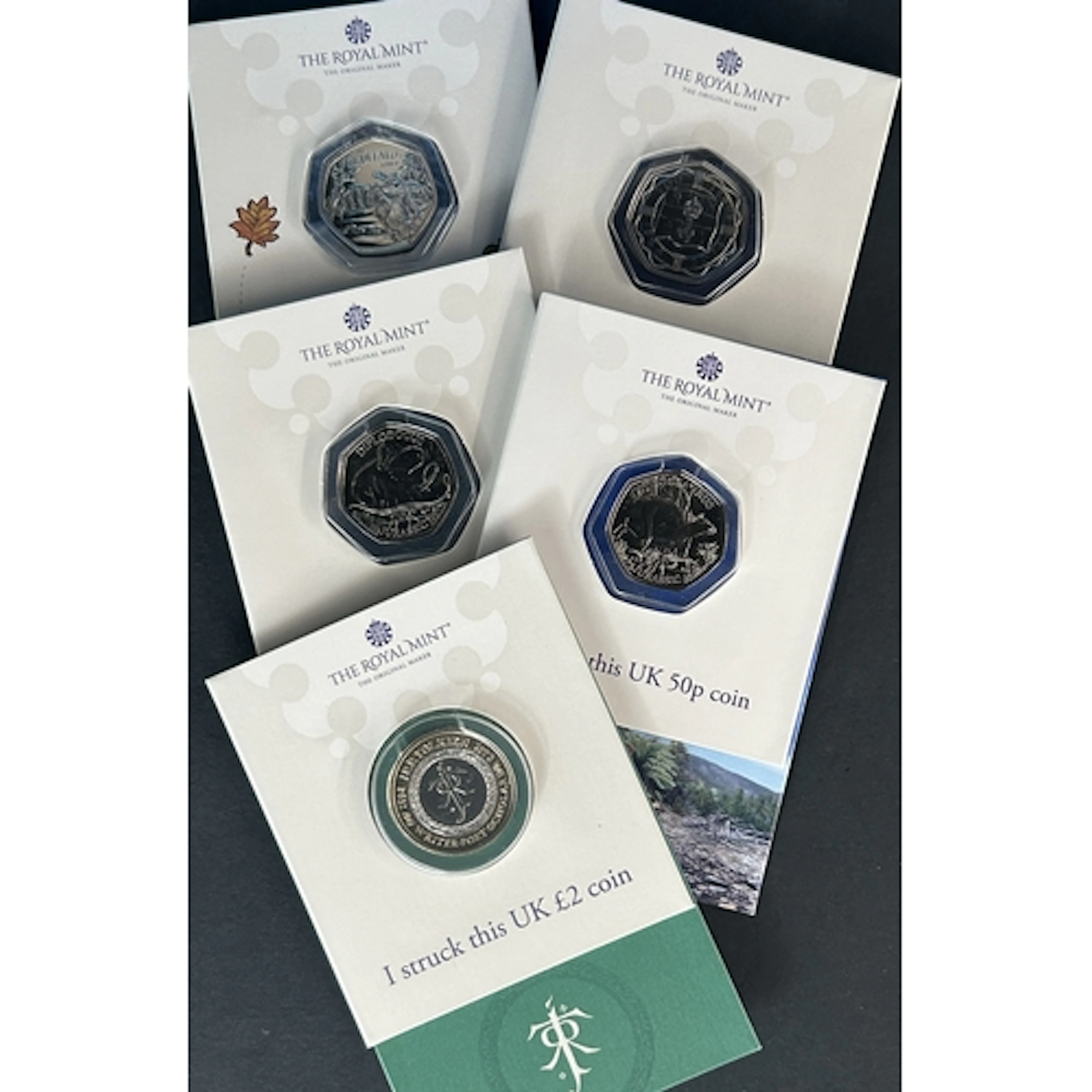 A group of five Great Britain Royal Mint Strike Your Own coi...