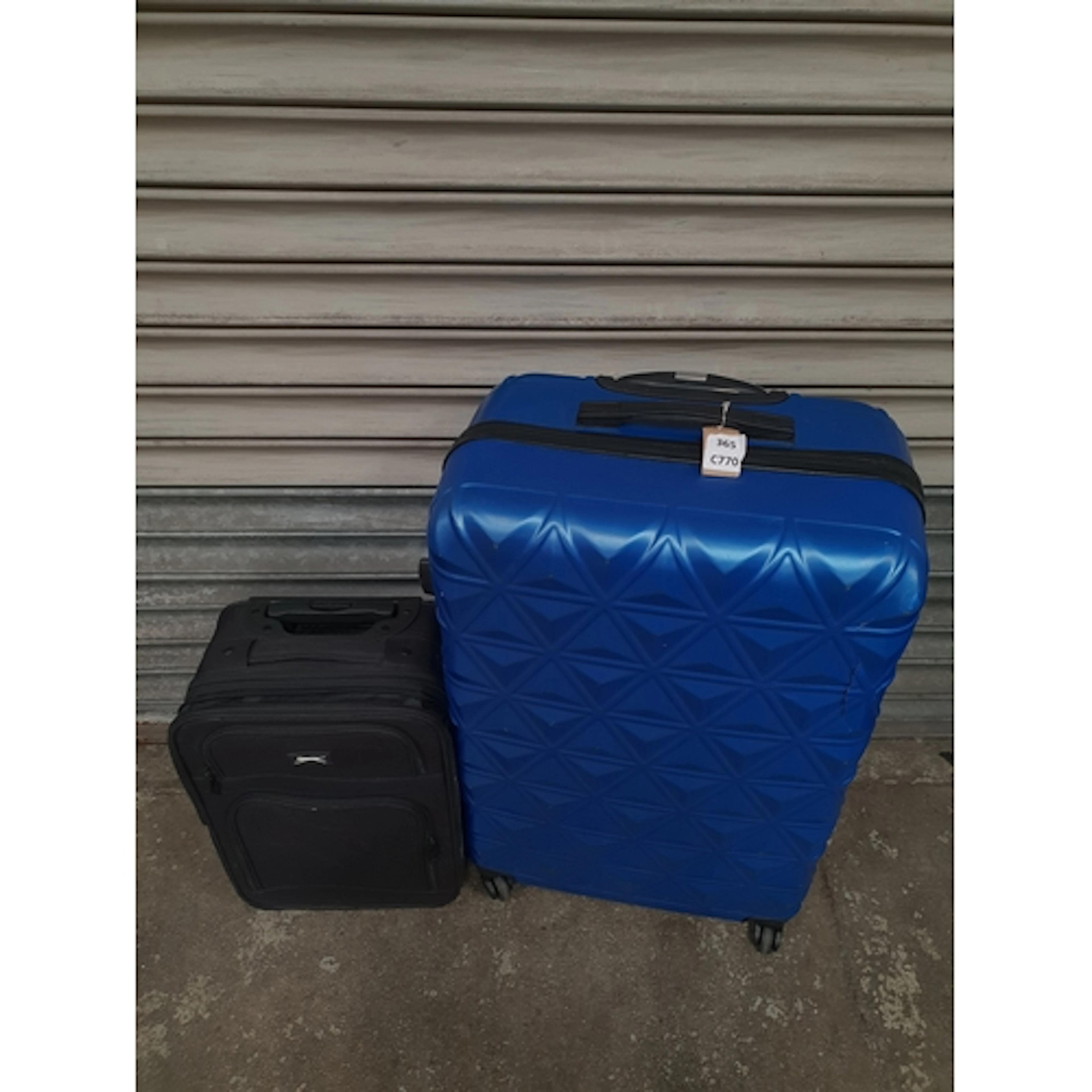 TWO SUITCASES including Puma Note: Suitcases and bags are em...