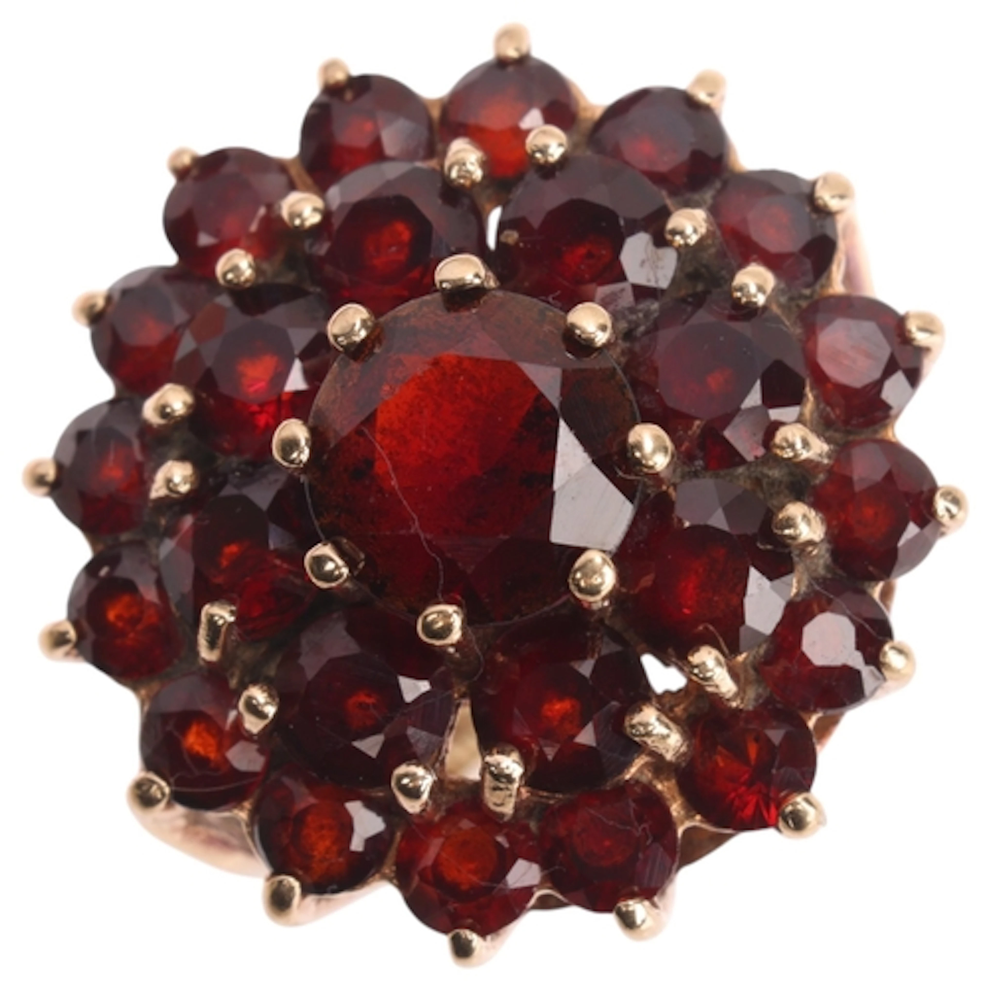 A 9ct gold garnet cluster ring, maker W & G, London 1973, se...