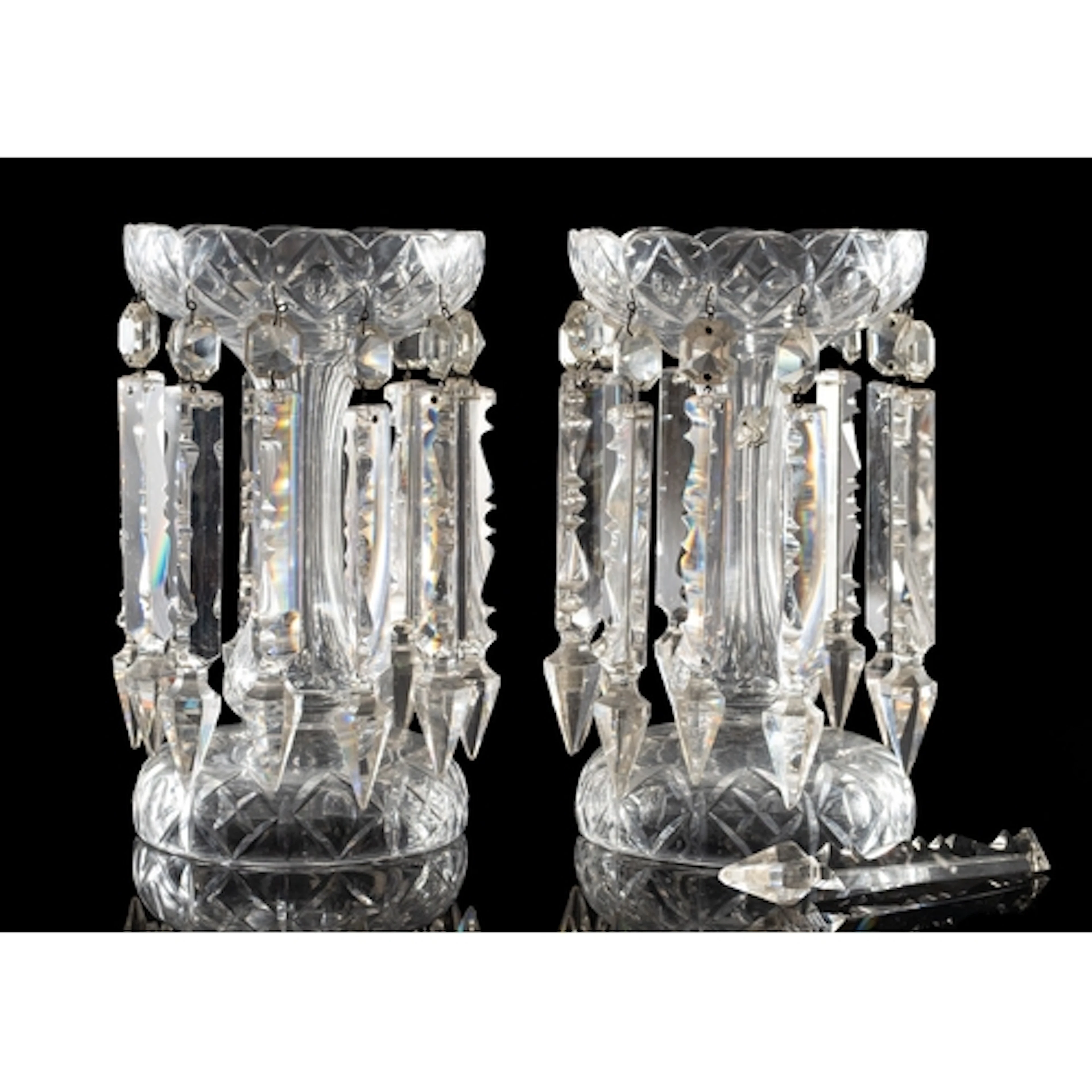 A pair of cut glass table lustres of typical form with bulbo...