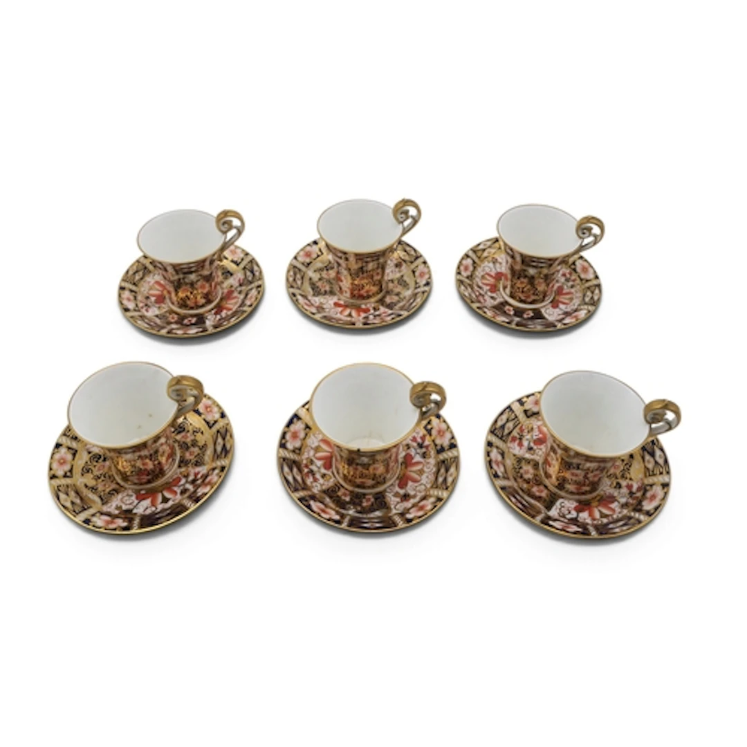 A set of six Royal Crown Derby coffee cups and saucers in 24...