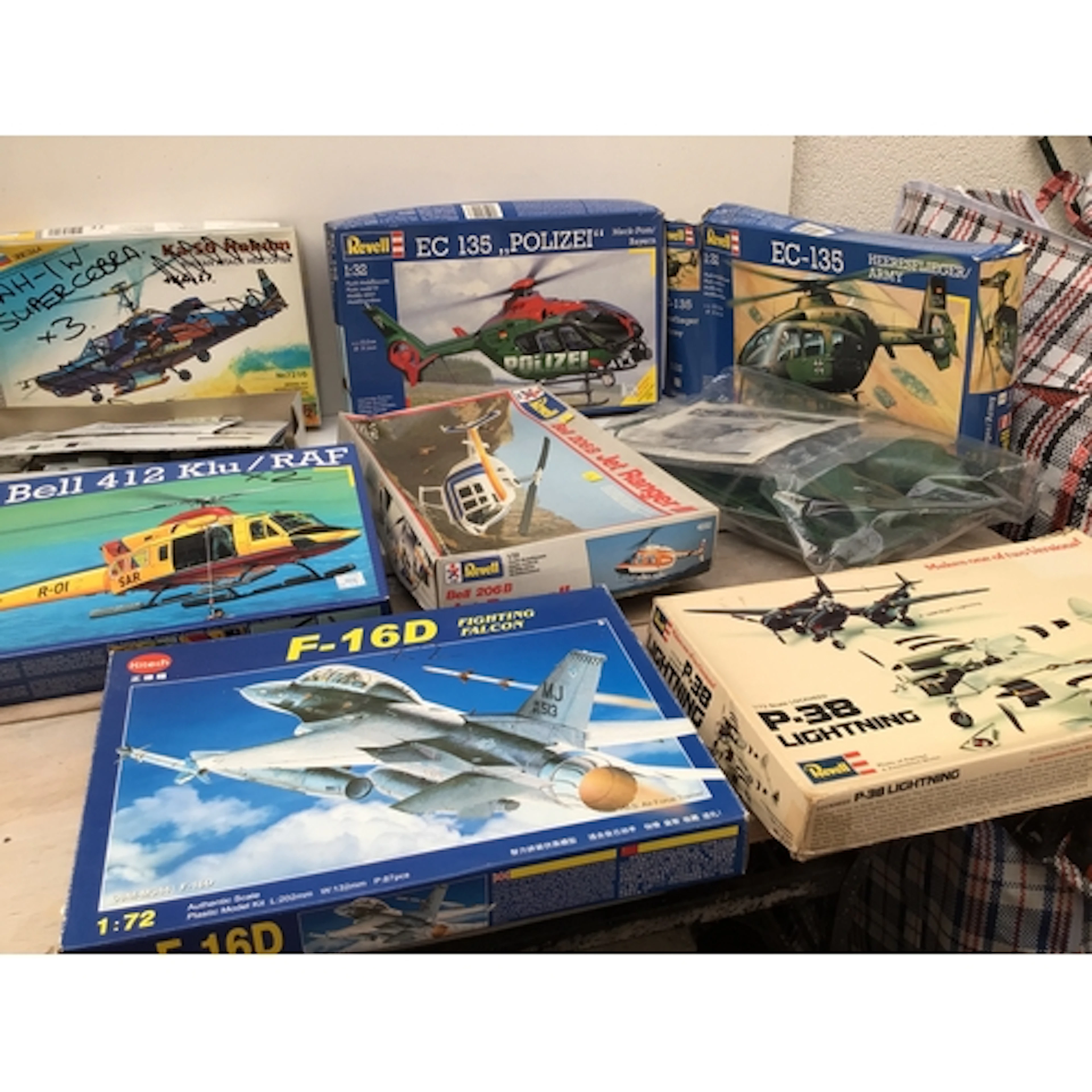 Bag containing a collection of boxed model kits by various m...