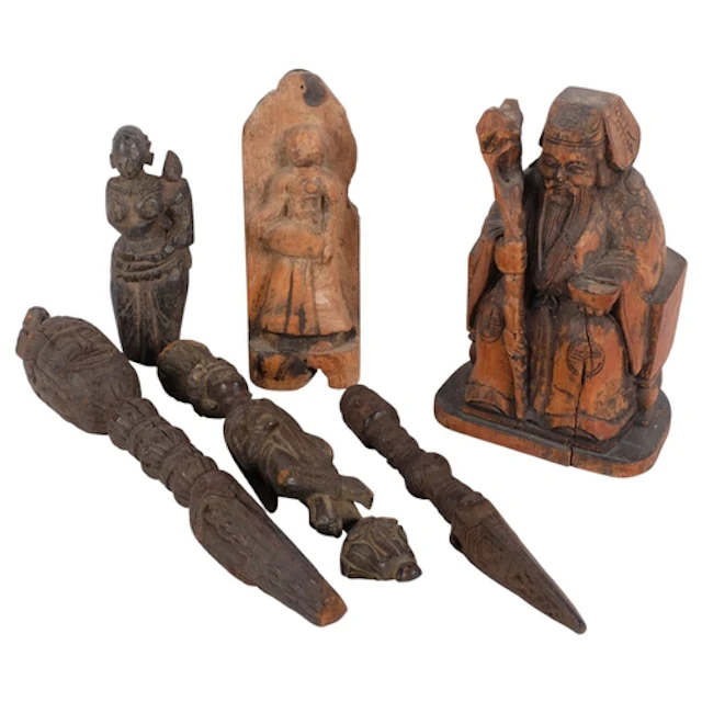 A group of Asian and Indian wood carvings