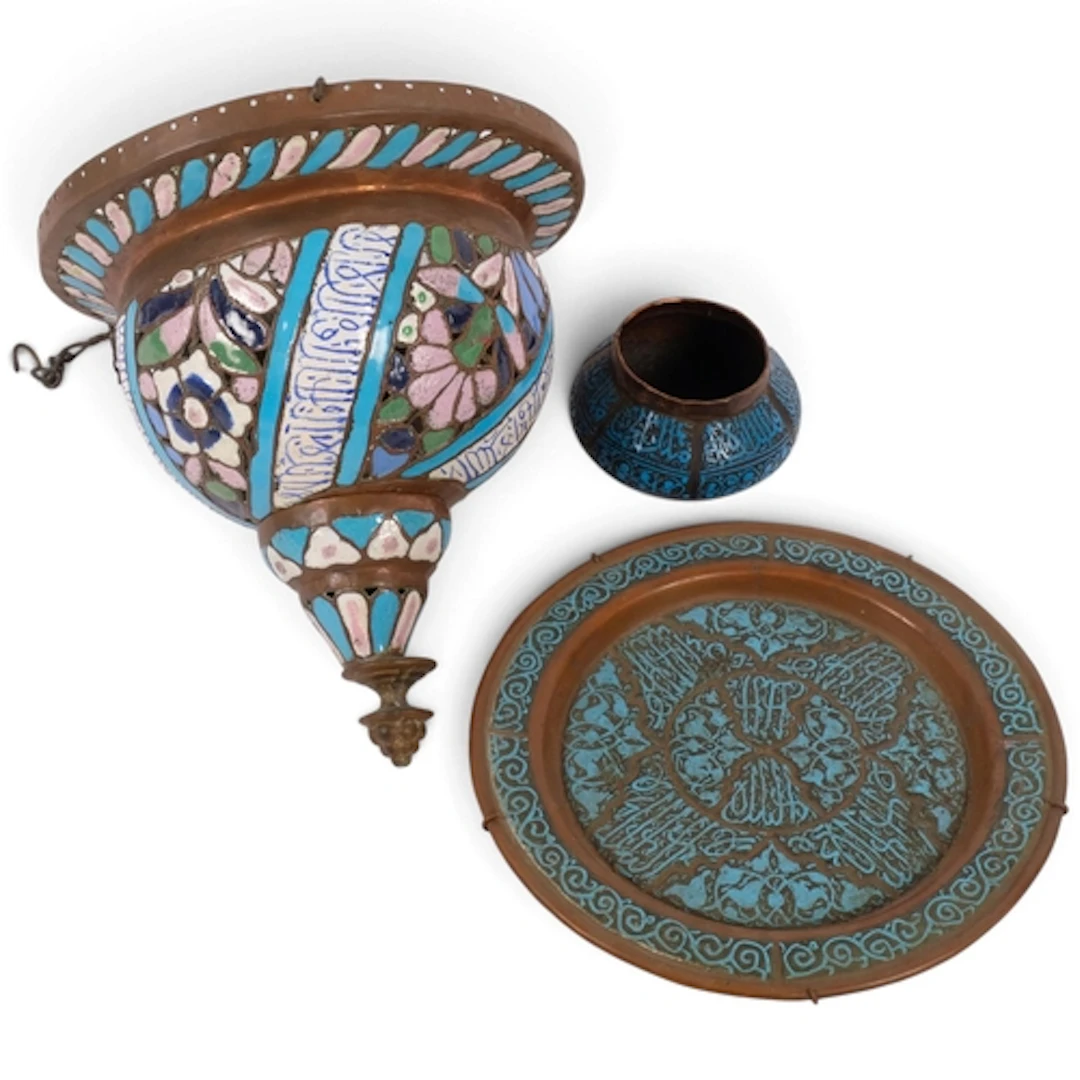 A Middle Eastern copper hanging light fitting, with enamel d...