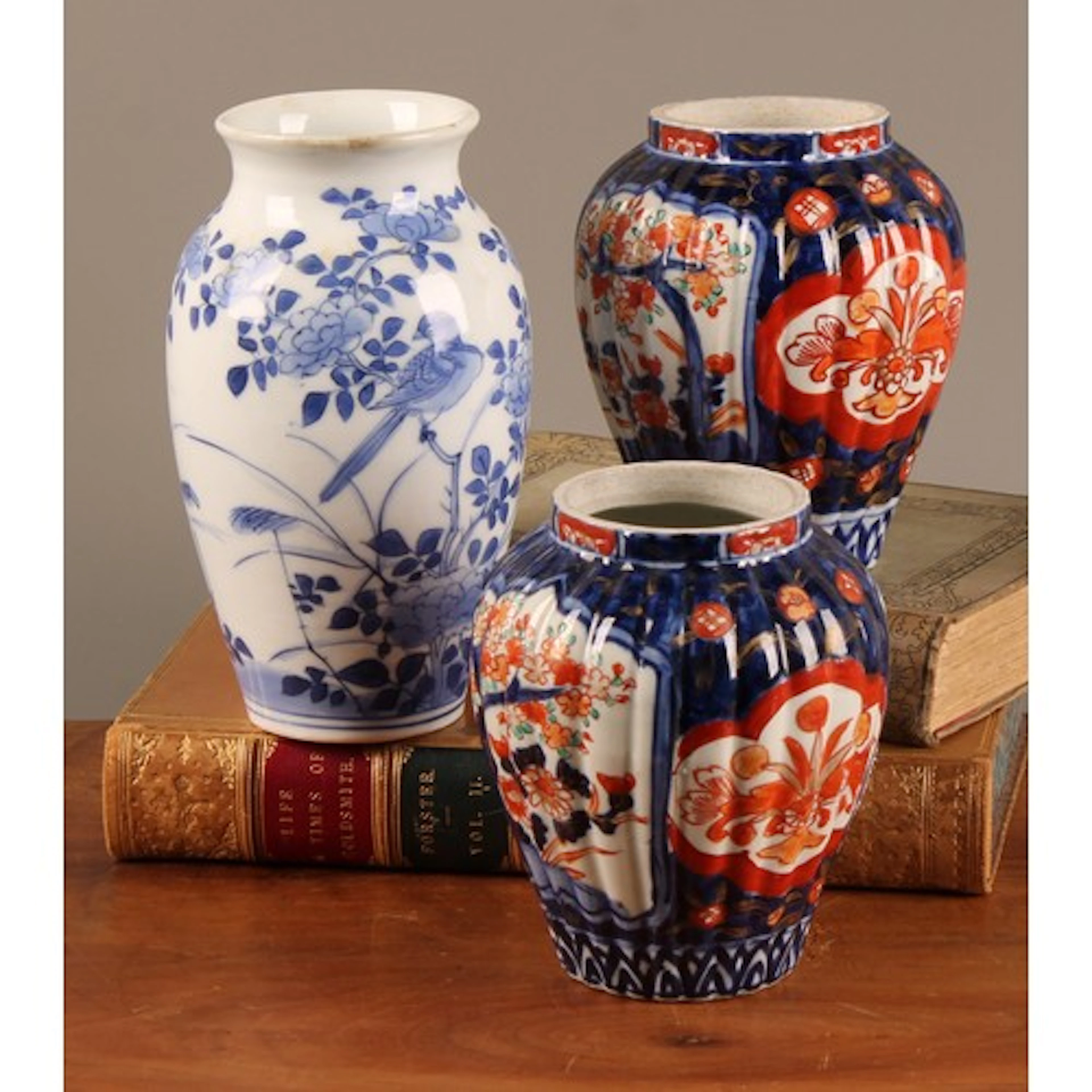 A pair of Japanese fluted ovoid vases, painted in the Imari ...