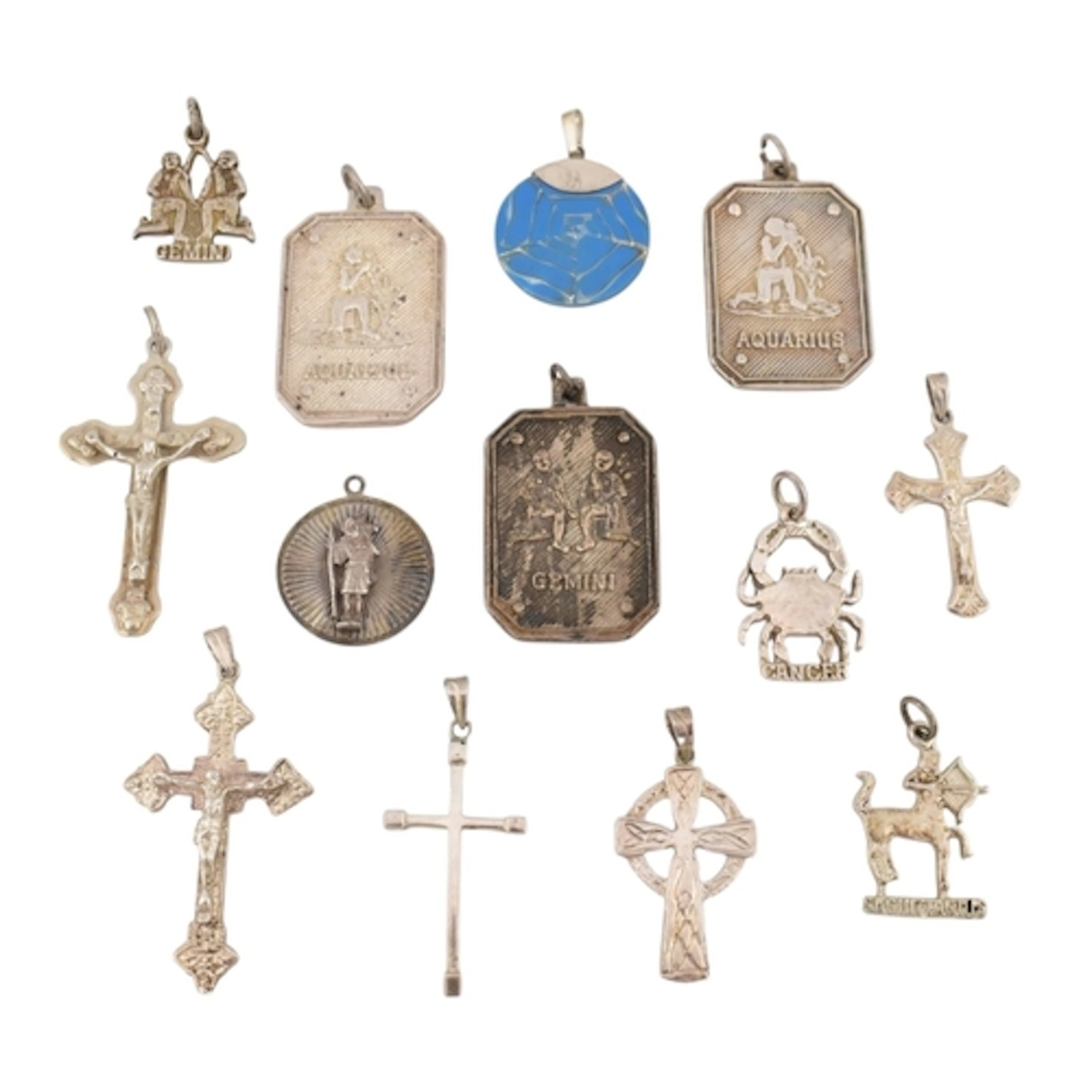 Collection of contemporary silver and white metal pendants. ...