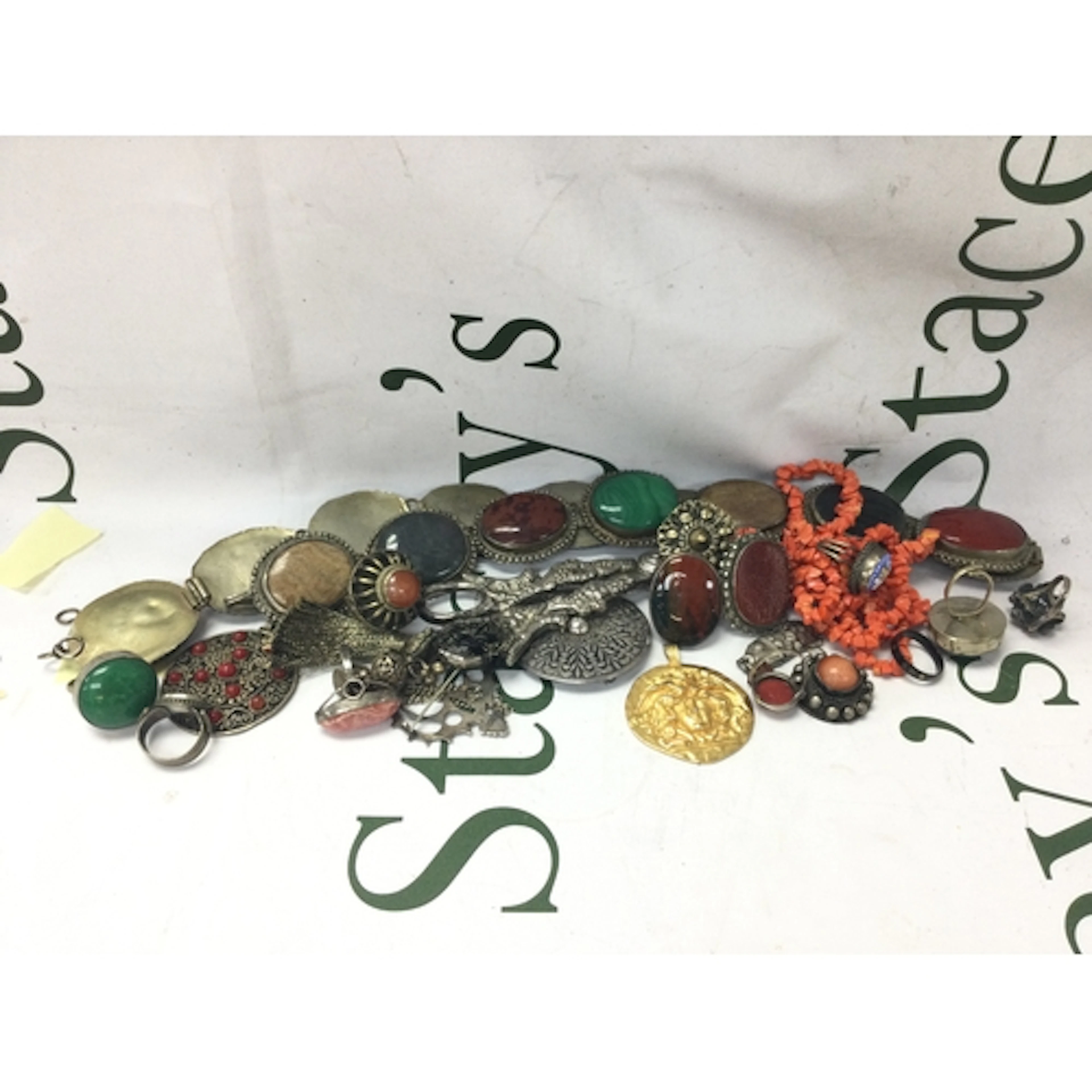 A collection of dress jewellery including a sphinx belt, har...